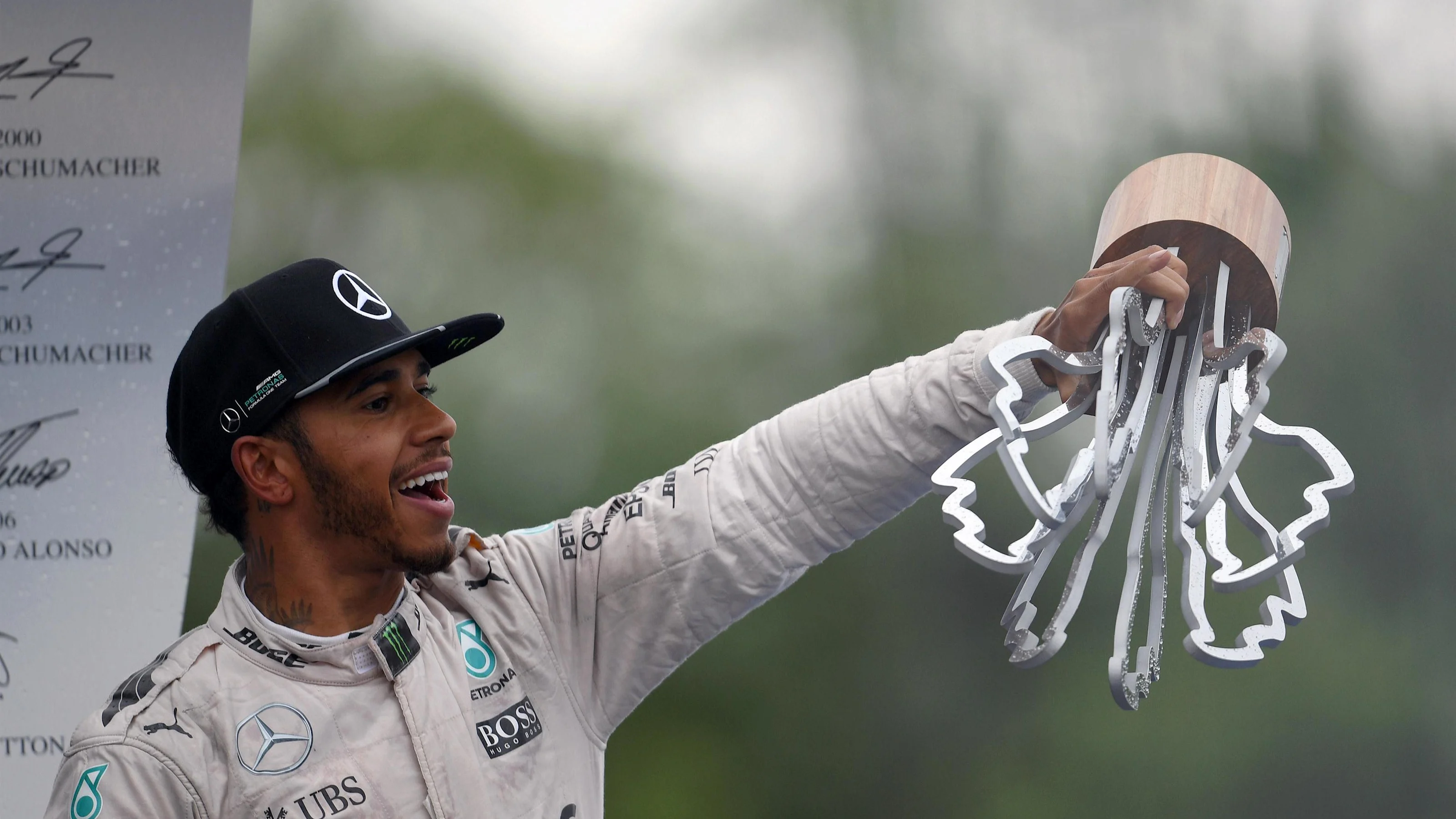 Race winner Lewis Hamilton (GBR) Mercedes AMG F1 celebrates on the podium with the trophy at