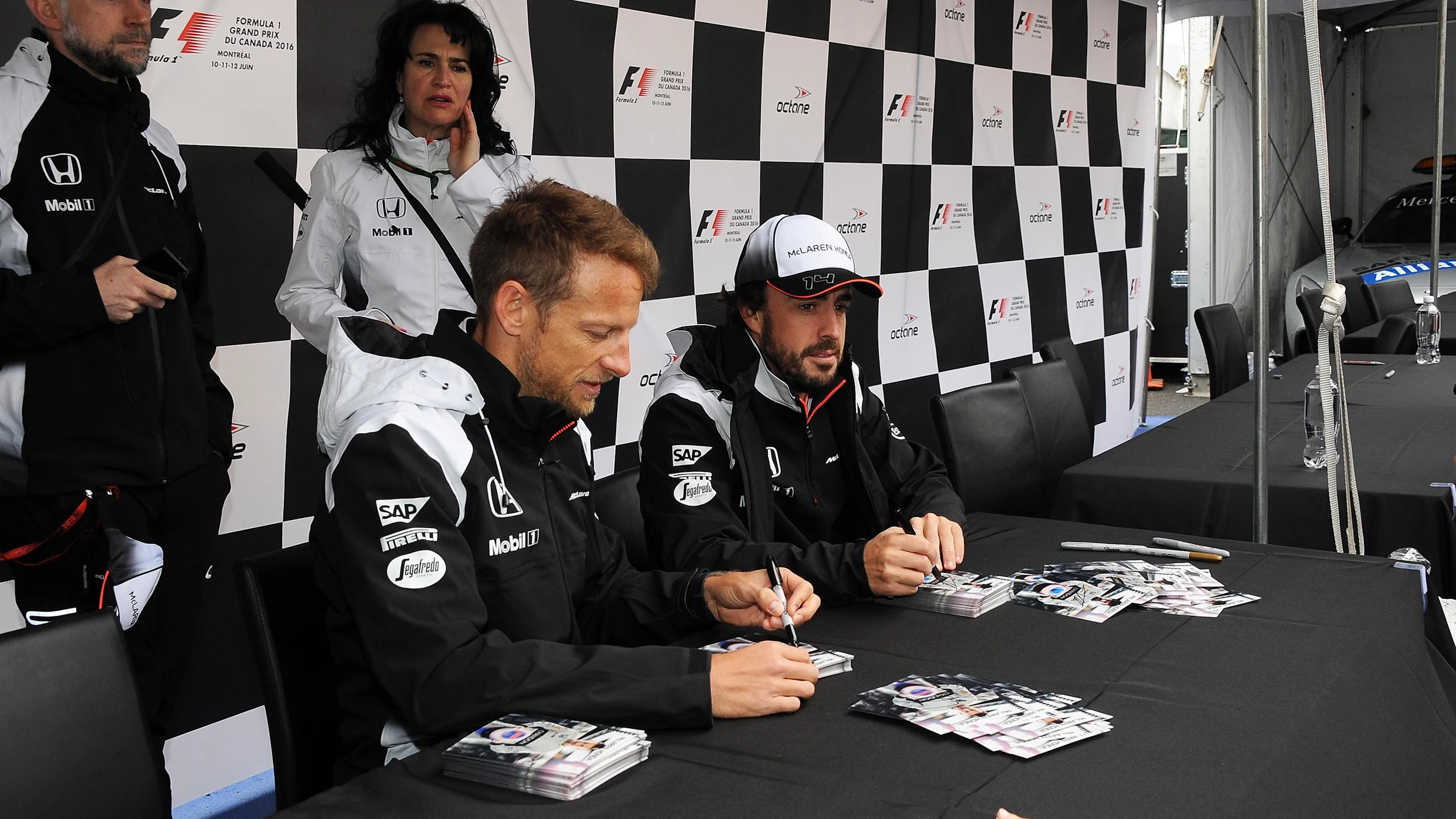 Jenson Button (GBR) McLaren and Fernando Alonso (ESP) McLaren at the autograph session at Formula