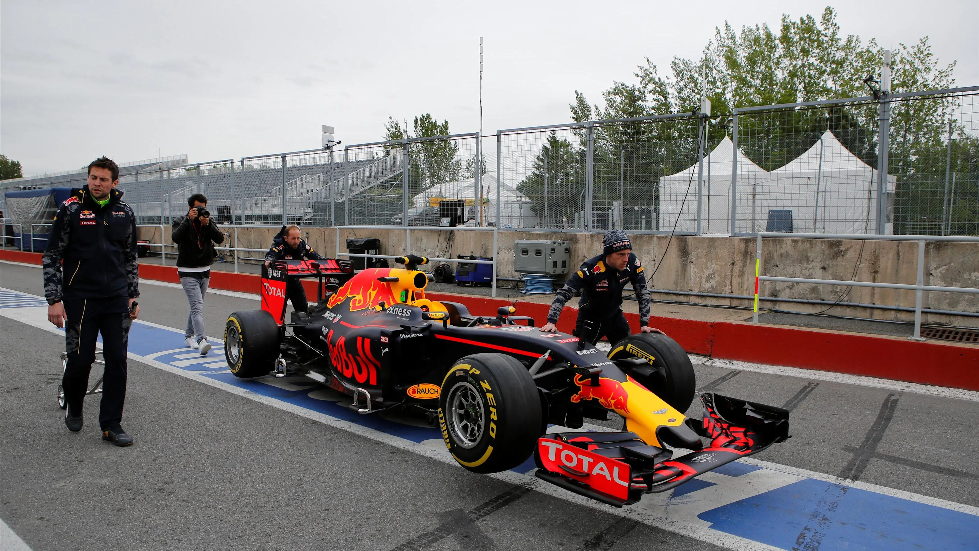 Red Bull Racing mechanics with Red Bull Racing RB12 at Formula One World Championship, Rd7,
