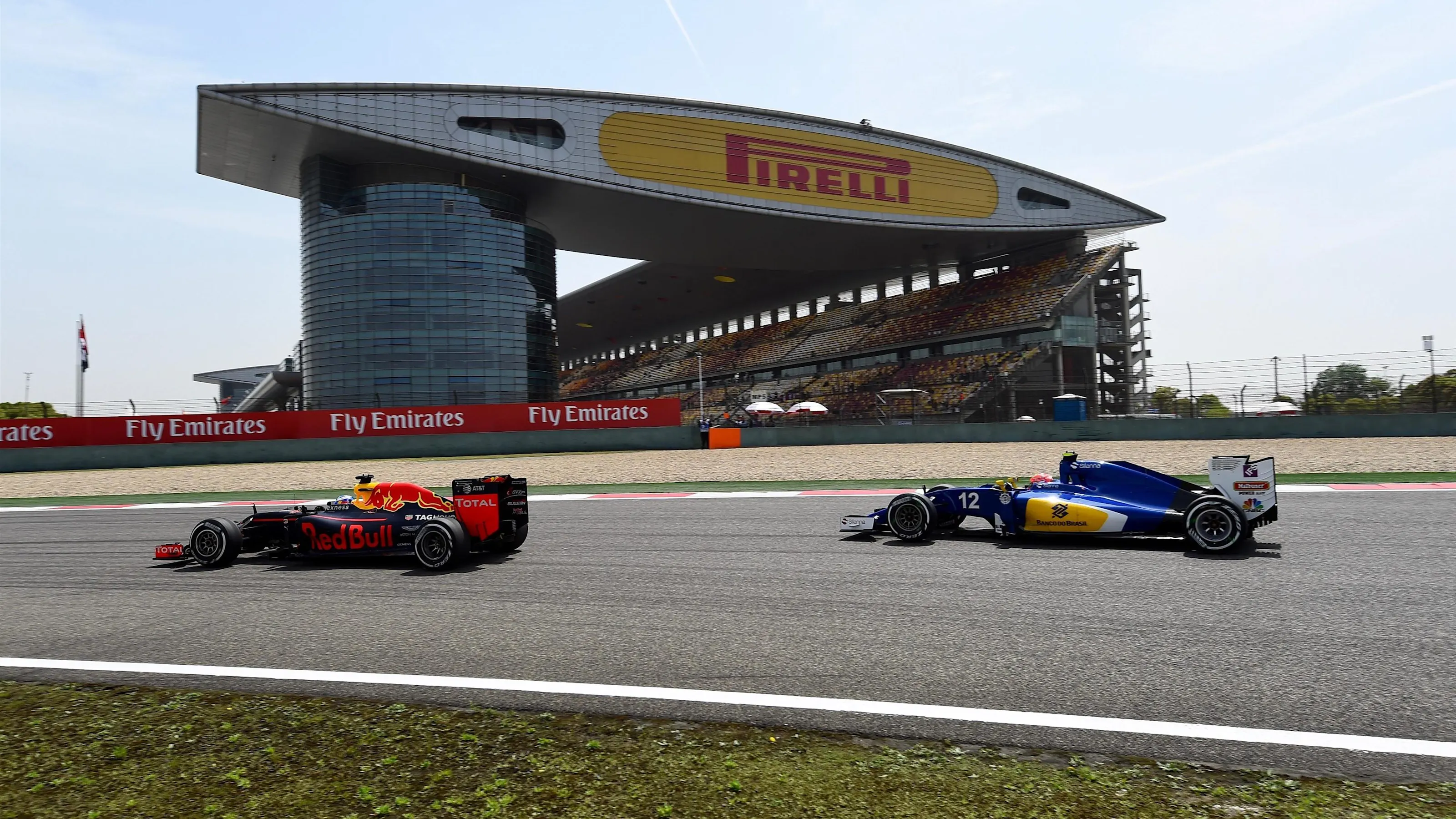 Daniel Ricciardo (AUS) Red Bull Racing RB12 and Felipe Nasr (BRA) Sauber C35 at Formula One World