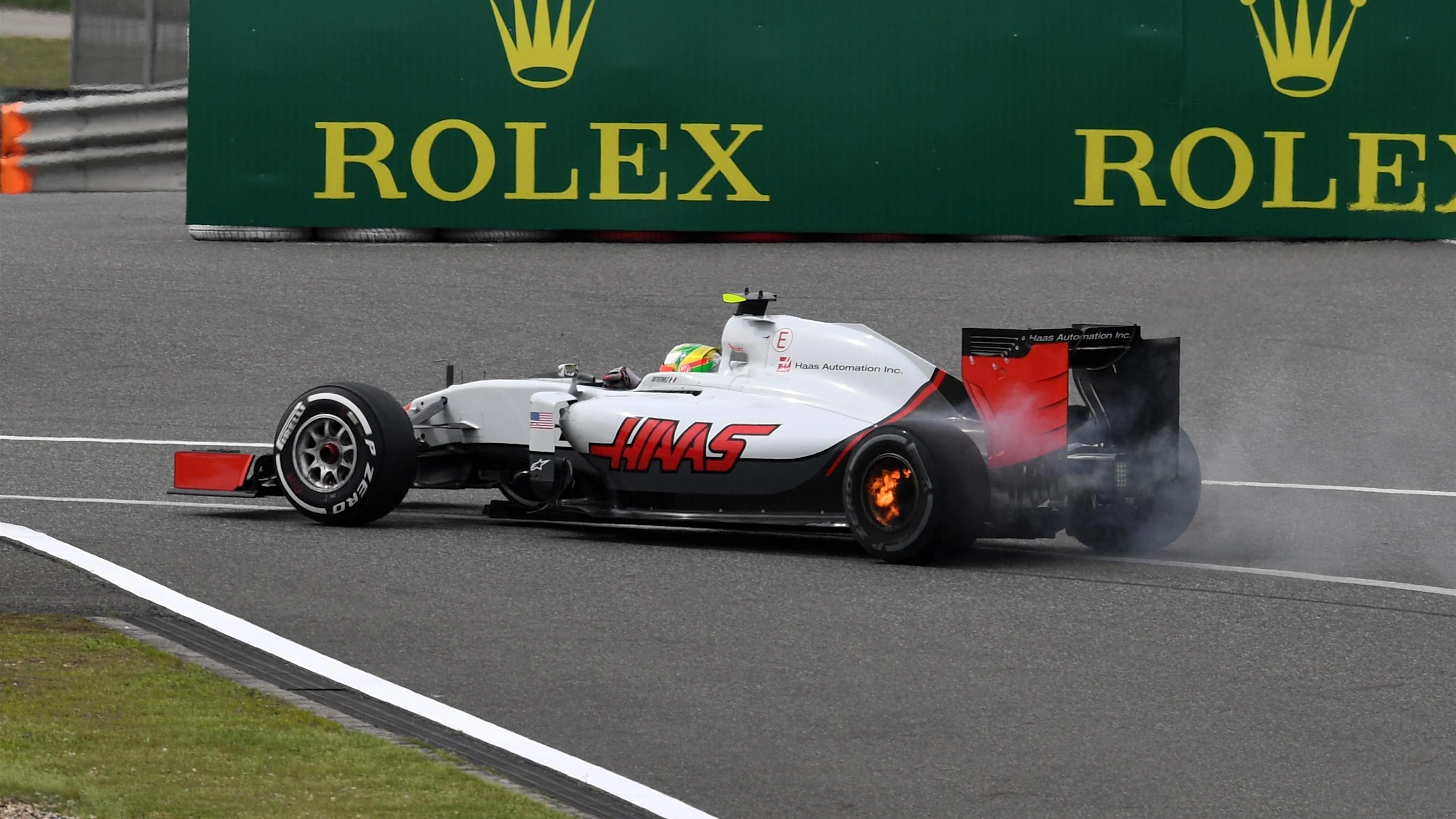 Esteban Gutierrez (MEX) Haas VF-16 with his rear brakes on fire at Formula One World Championship,