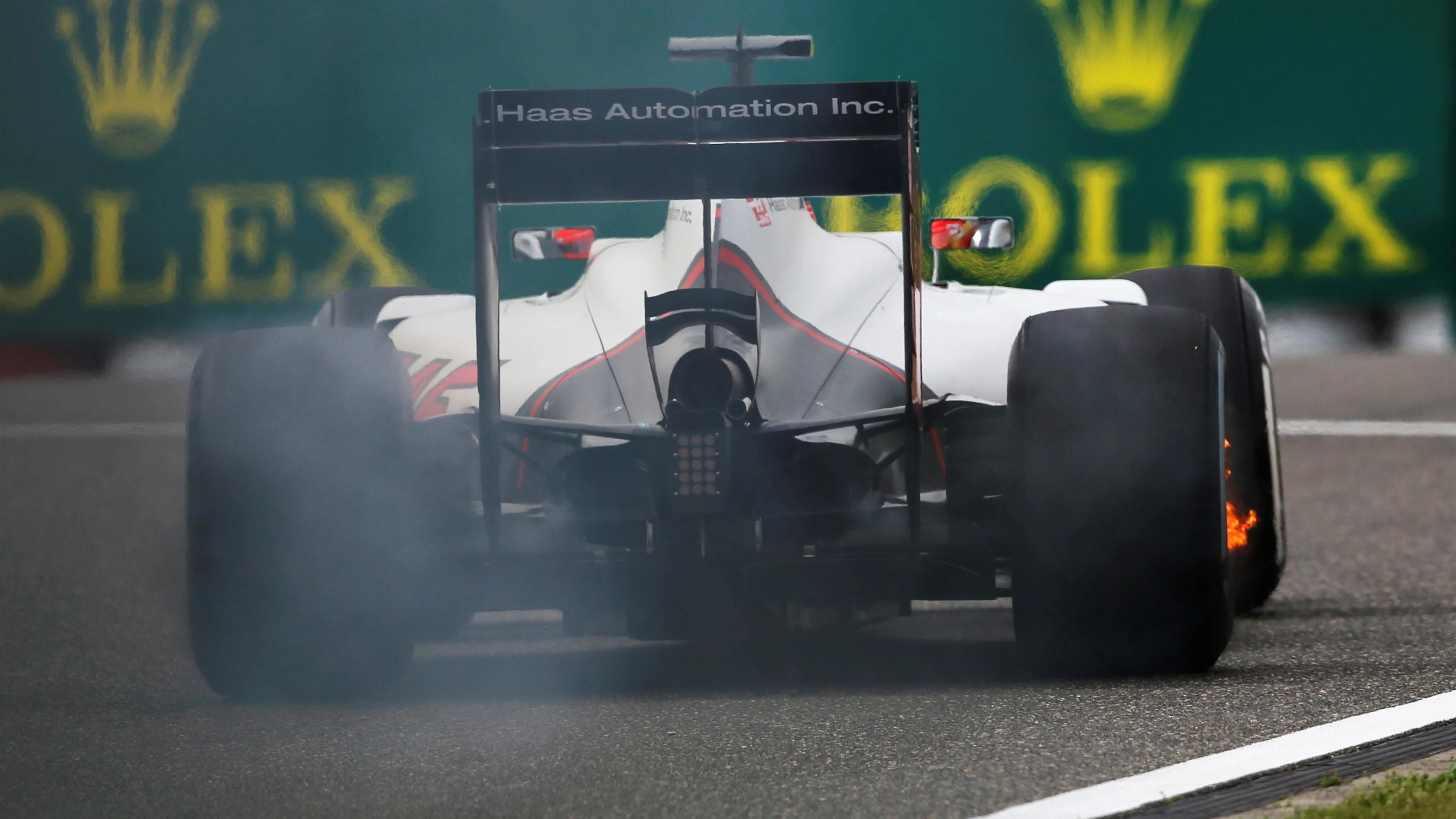 Esteban Gutierrez (MEX) Haas VF-16 with his rear brakes on fire at Formula One World Championship,