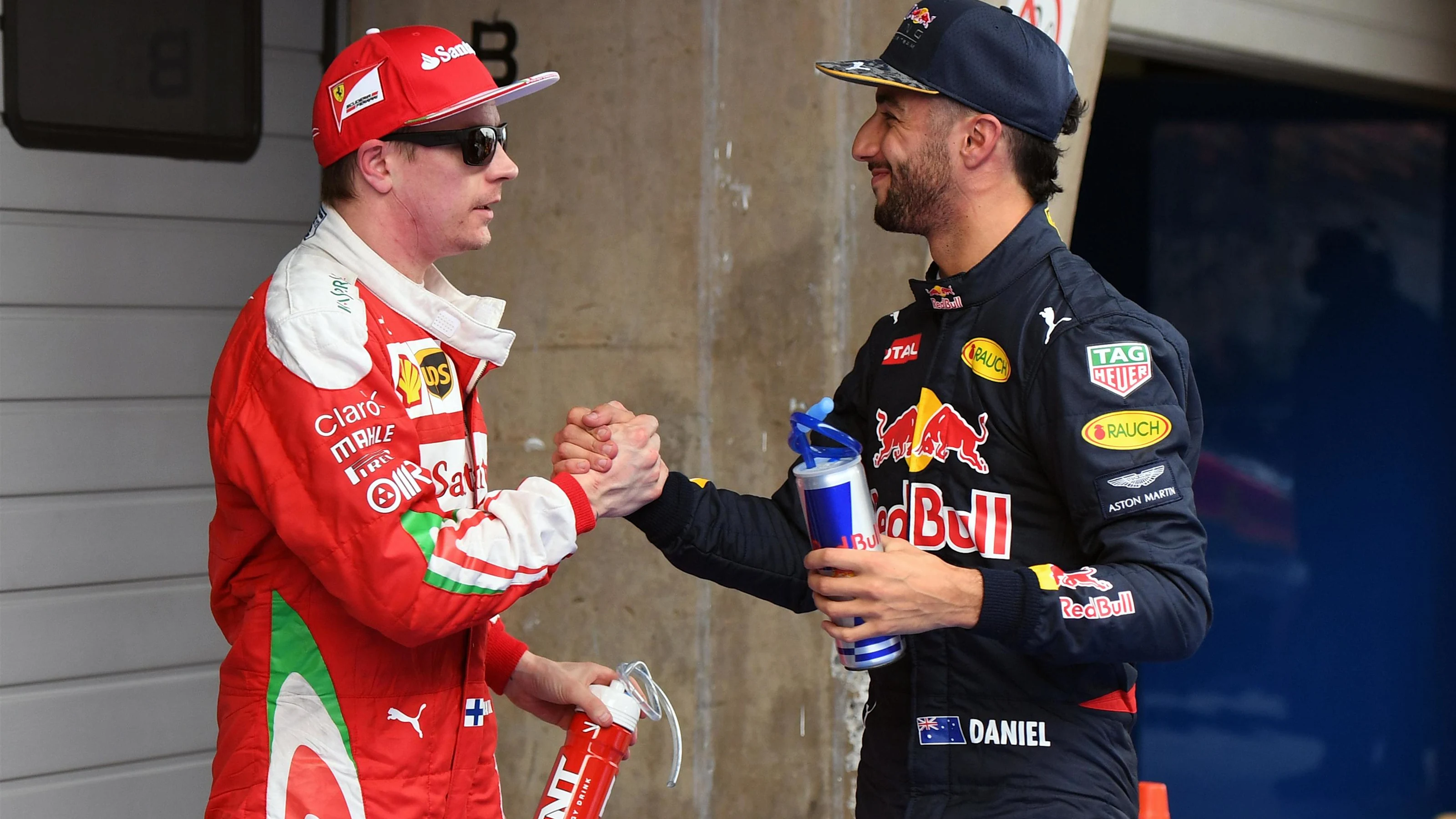 Kimi Raikkonen (FIN) Ferrari and Daniel Ricciardo (AUS) Red Bull Racing celebrate in parc ferme at