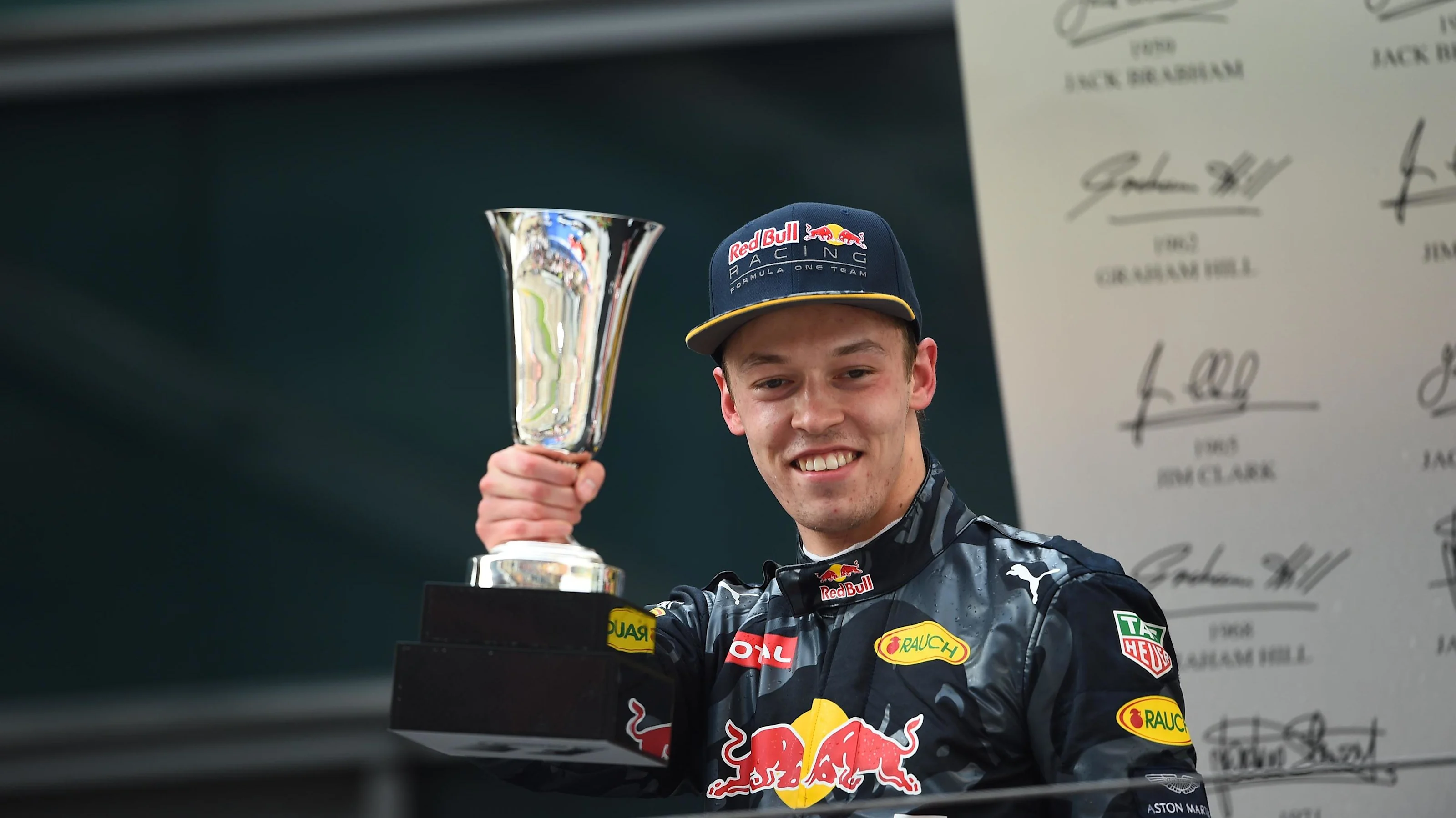 Daniil Kyvat (RUS) Red Bull Racing celebrates on the podium with the trophy at Formula One World