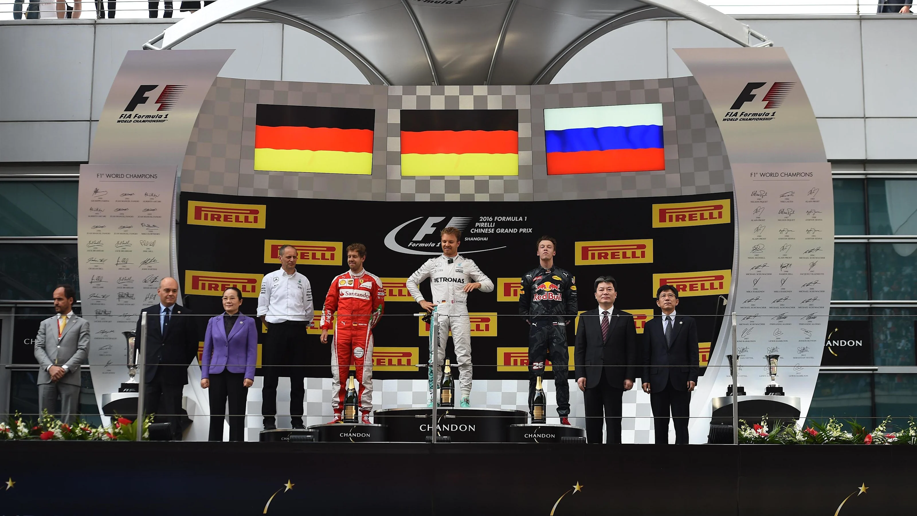 (L to R): Sebastian Vettel (GER) Ferrari, race winner Nico Rosberg (GER) Mercedes AMG F1 and Daniil