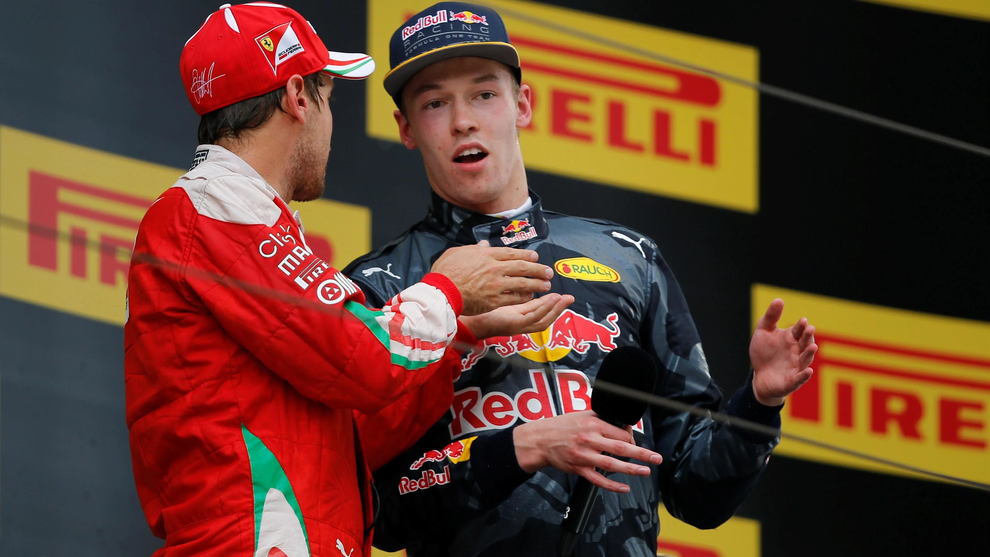 Sebastian Vettel (GER) Ferrari and Daniil Kvyat (RUS) Red Bull Racing on the podium at Formula One