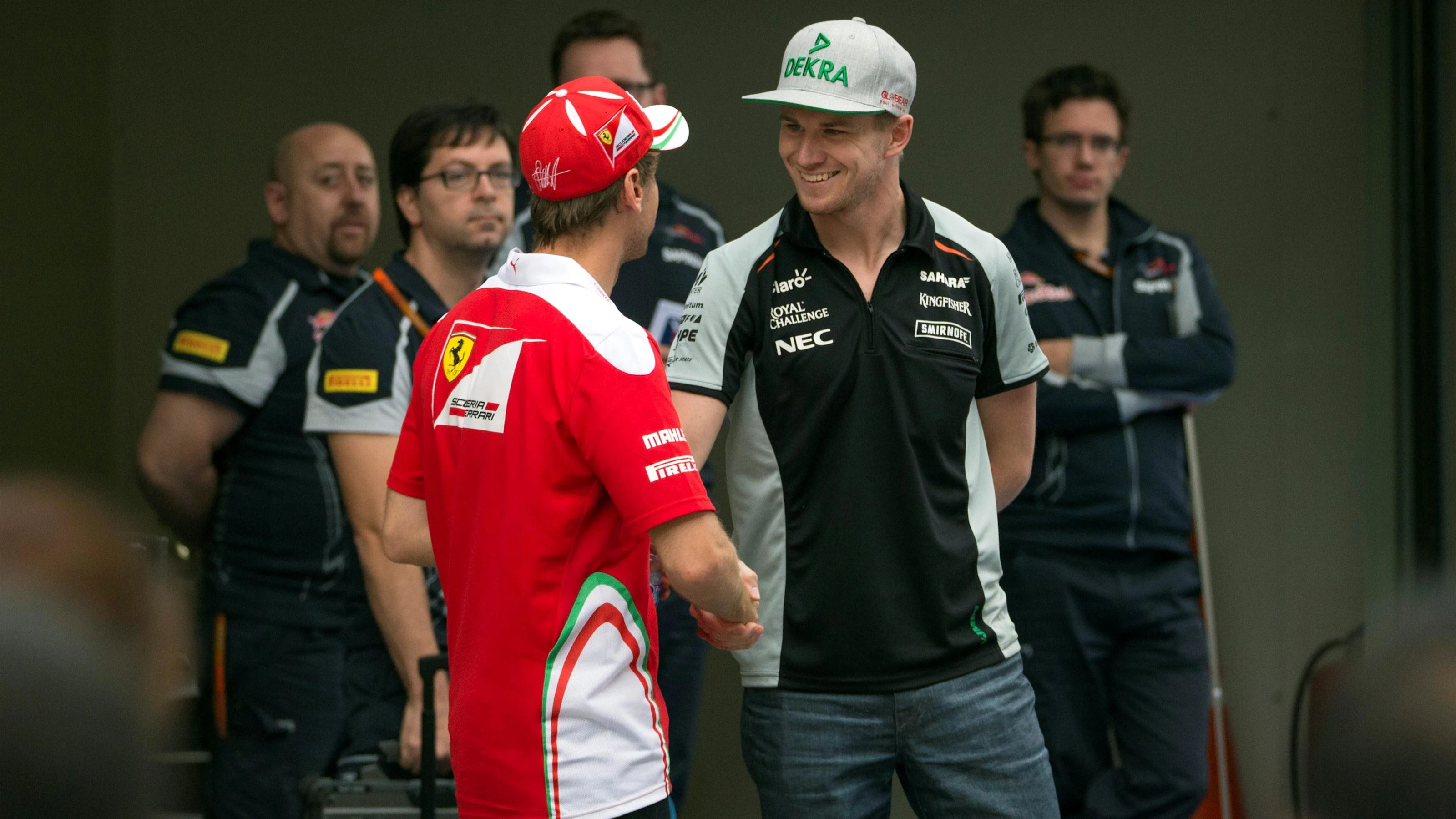 Nico Hulkenberg (GER) Force India F1 and Sebastian Vettel (GER) Ferrari at Formula One World