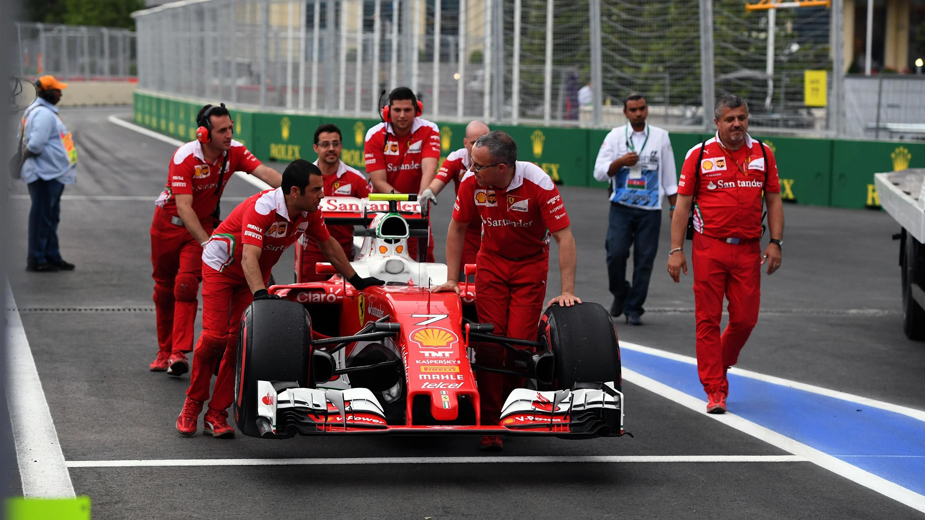 Ferrari mechaincs with Ferrari SF16-H in pit lane at Formula One World Championship, Rd8, European