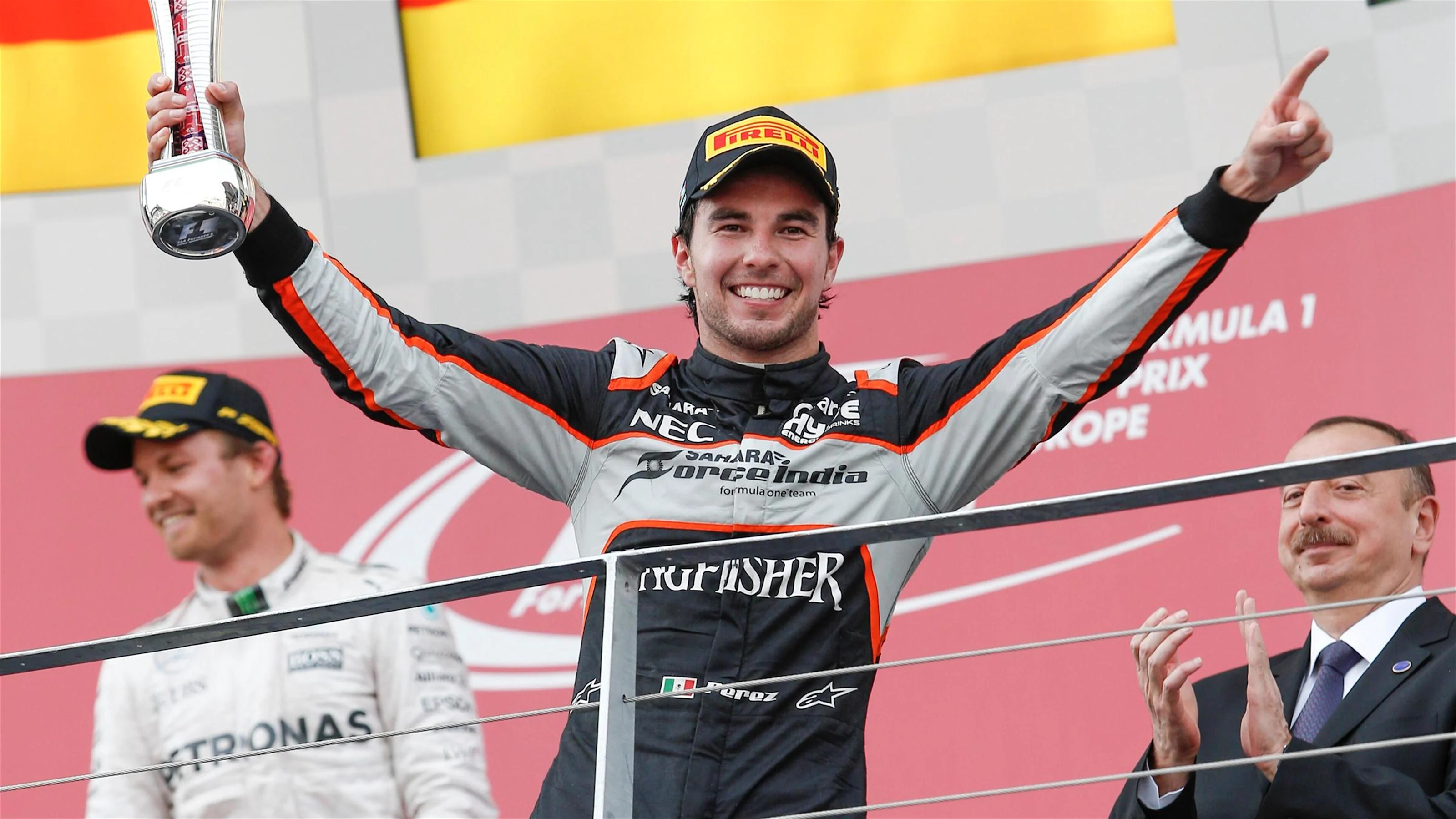 Sergio Perez (MEX) Force India celebrates on the podium with the trophy at Formula One World