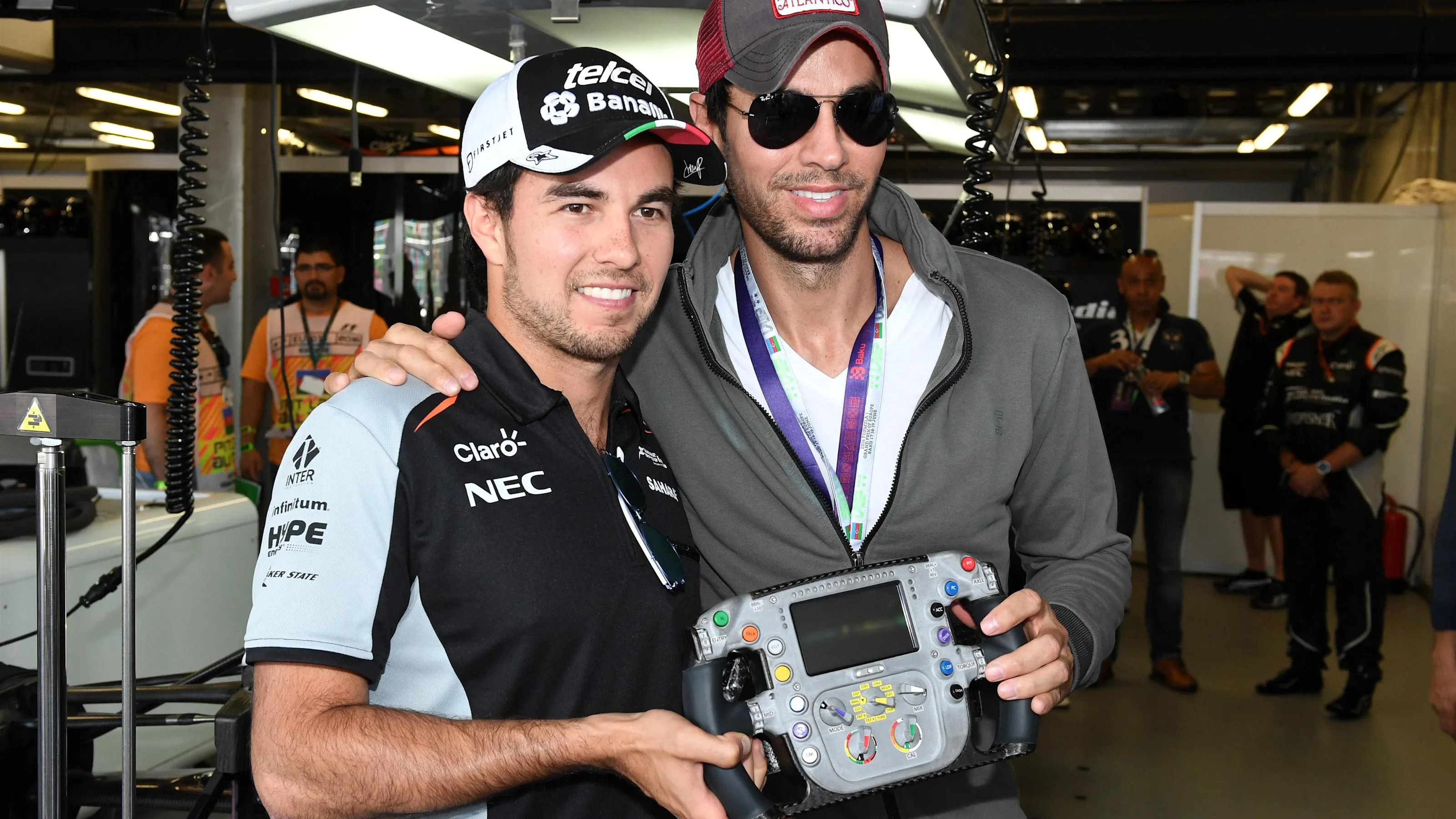 Sergio Perez (MEX) Force India and Enrique Iglesias (ESP) at Formula One World Championship, Rd8,