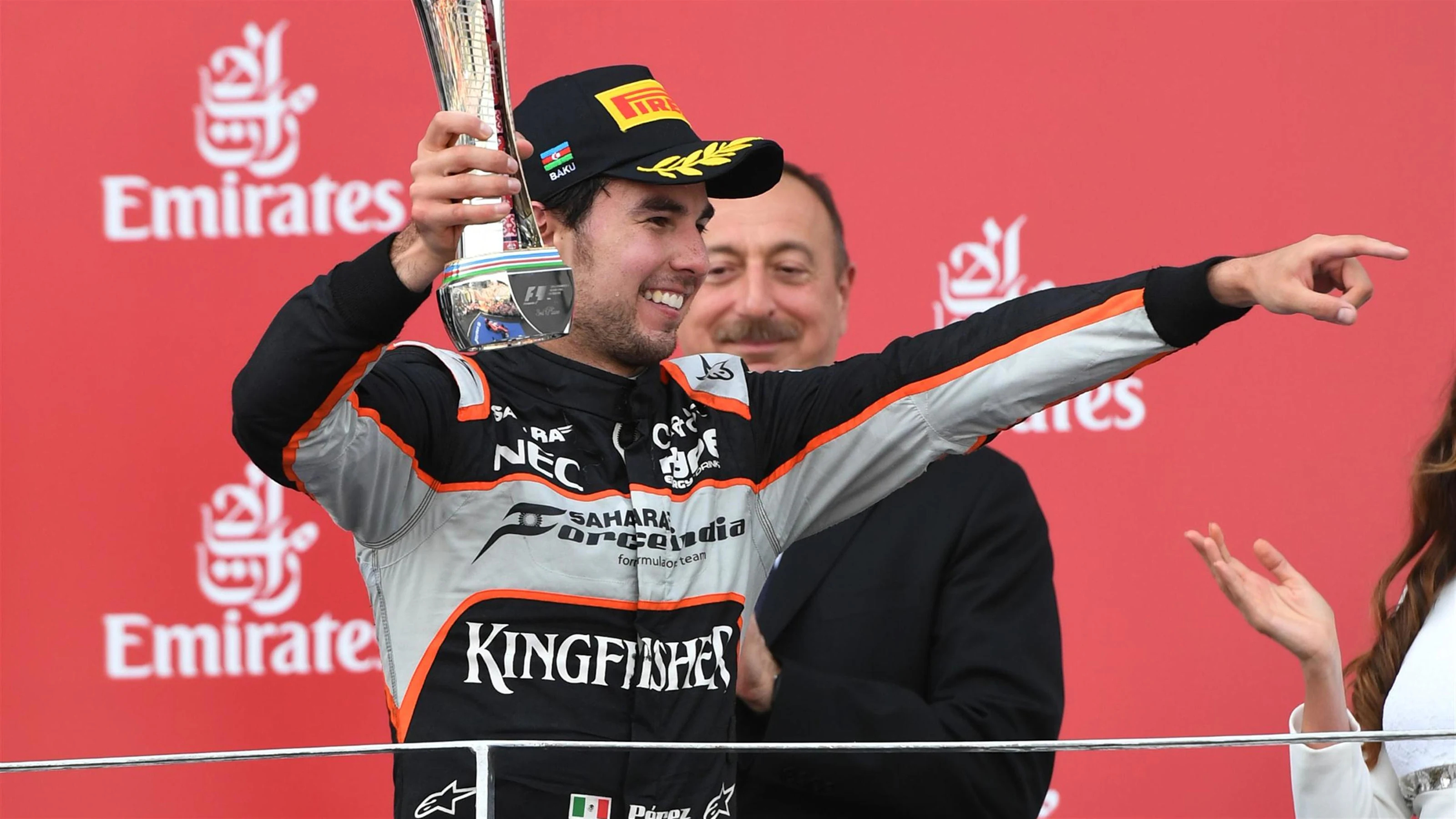 Sergio Perez (MEX) Force India celebrates on the podium with the trophy at Formula One World