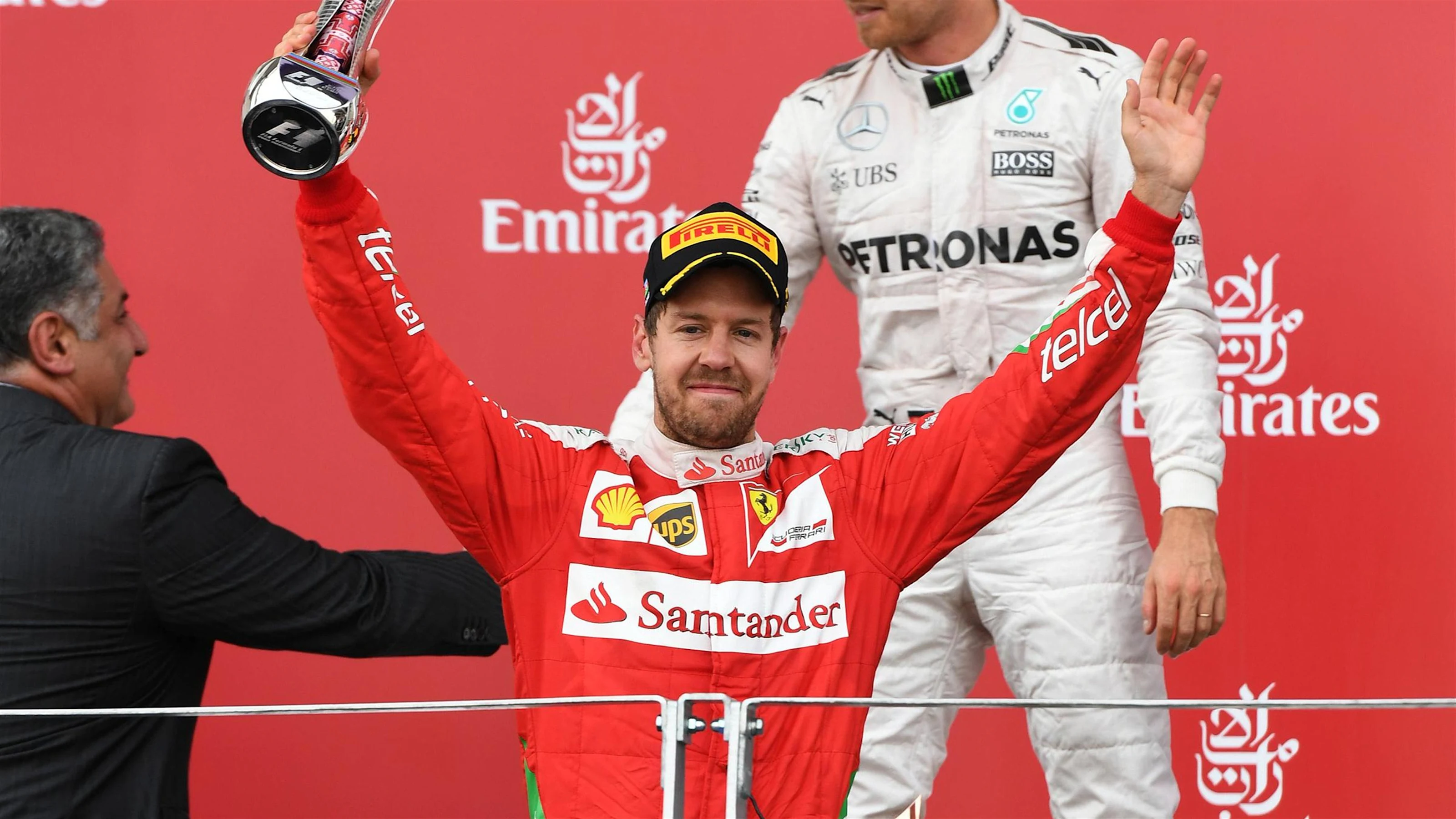 Sebastian Vettel (GER) Ferrari celebrates on the podium with the trophy at Formula One World