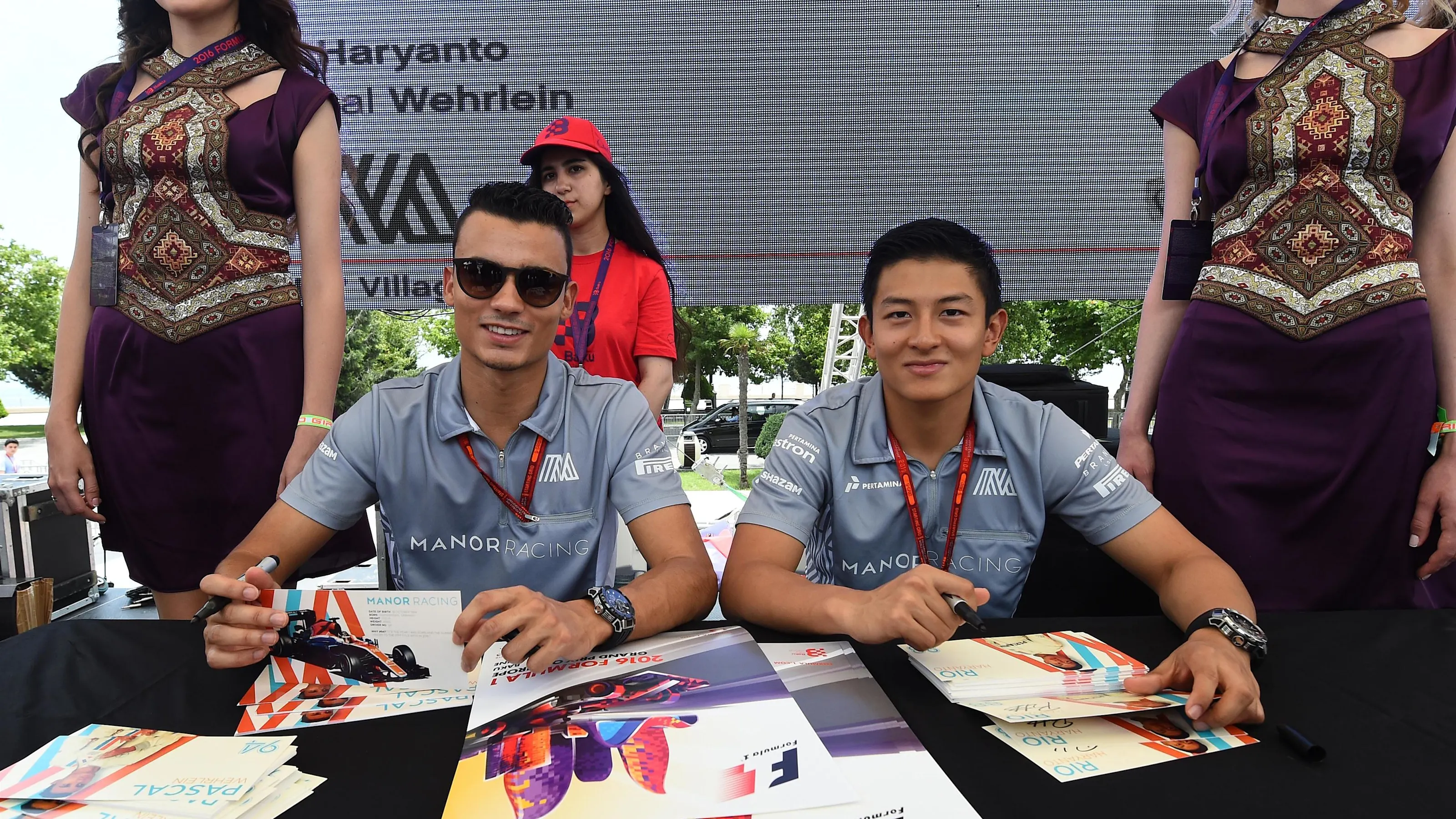 Pascal Wehrlein (GER) Manor Racing and Rio Haryanto (IDN) Manor Racing at the autograph session at