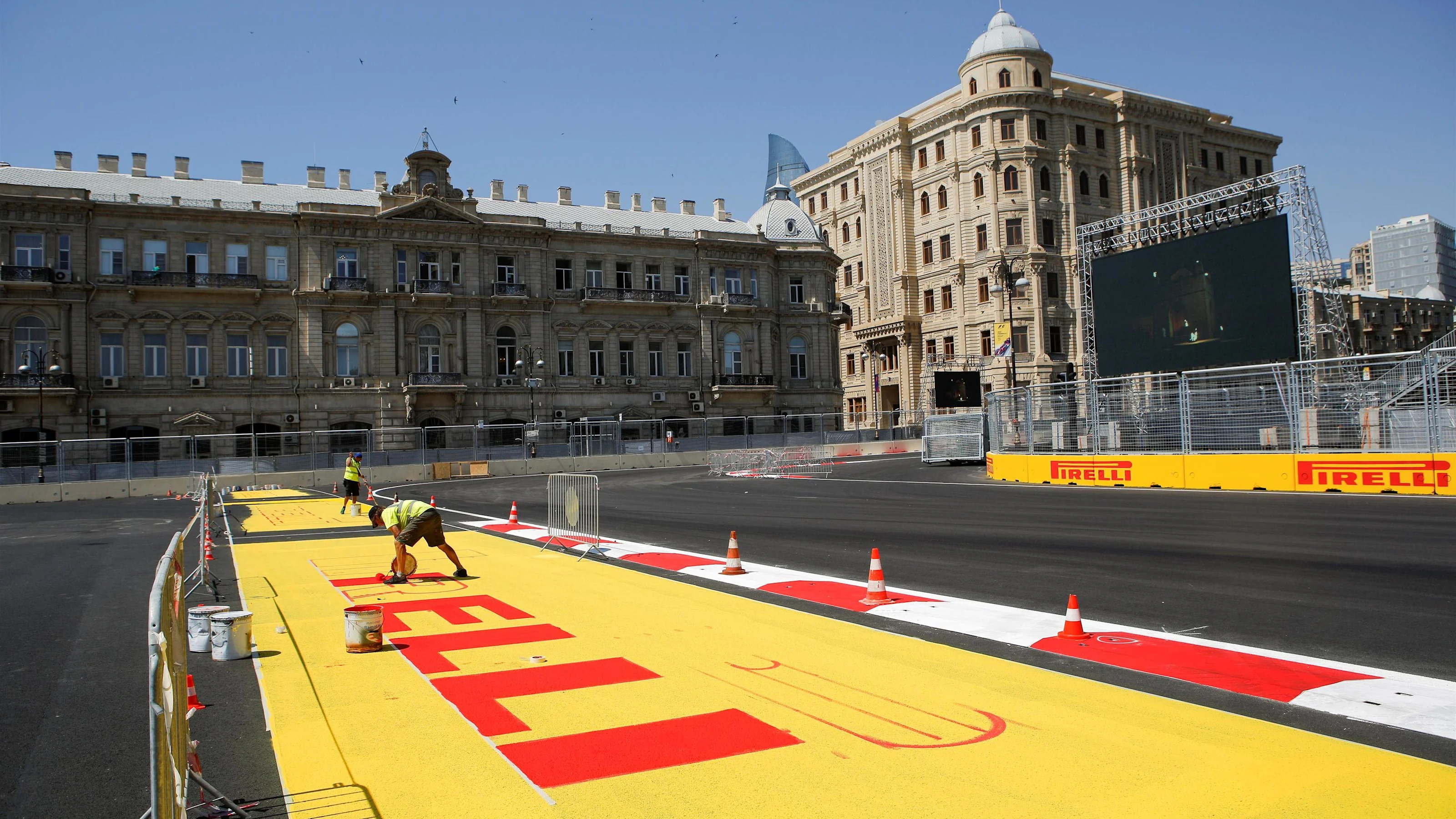 Track signage is painted at Formula One World Championship, Rd8, European Grand Prix, Preparations,