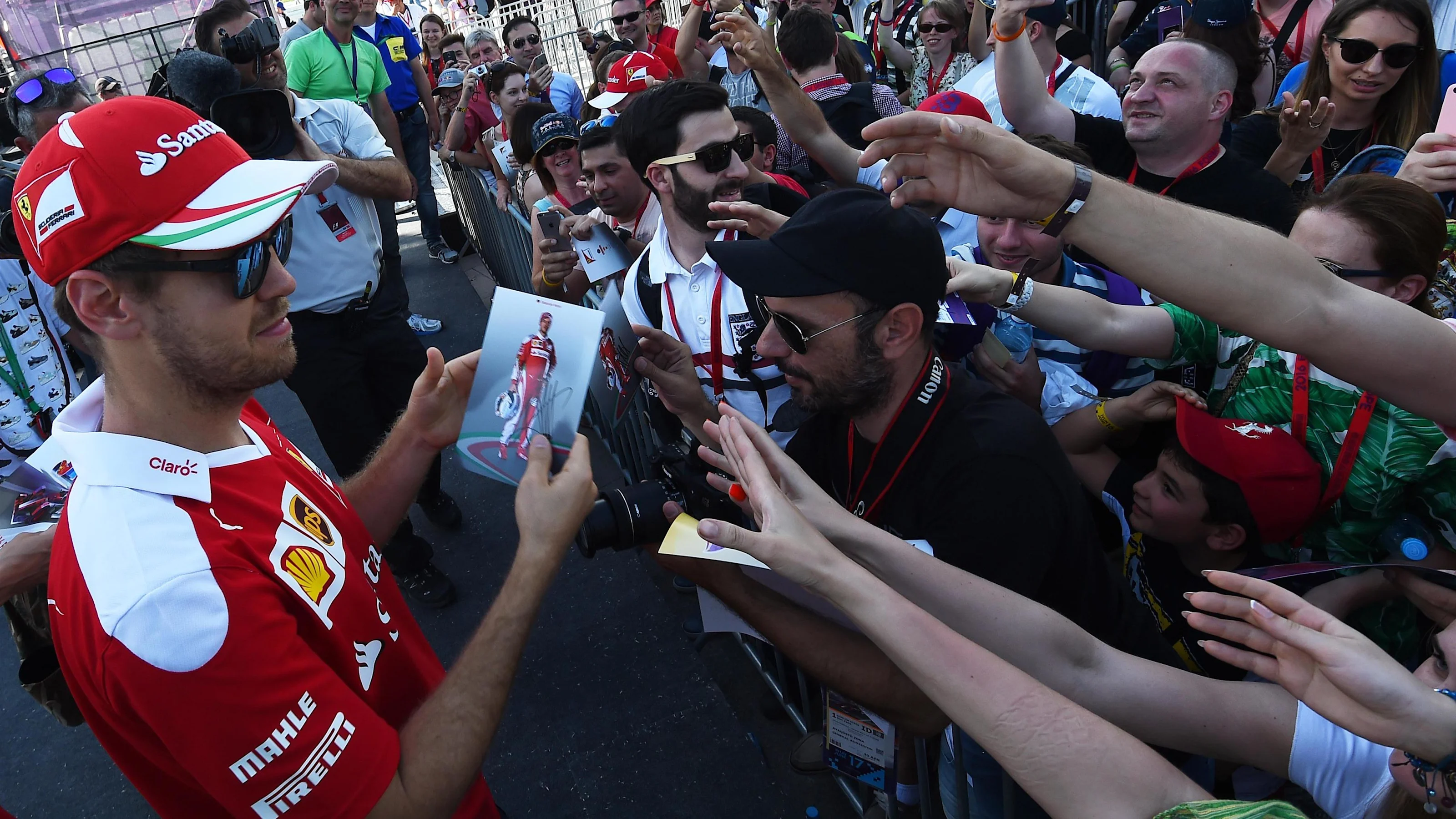 Sebastian Vettel (GER) Ferrari autographs for the fans at Formula One World Championship, Rd8,