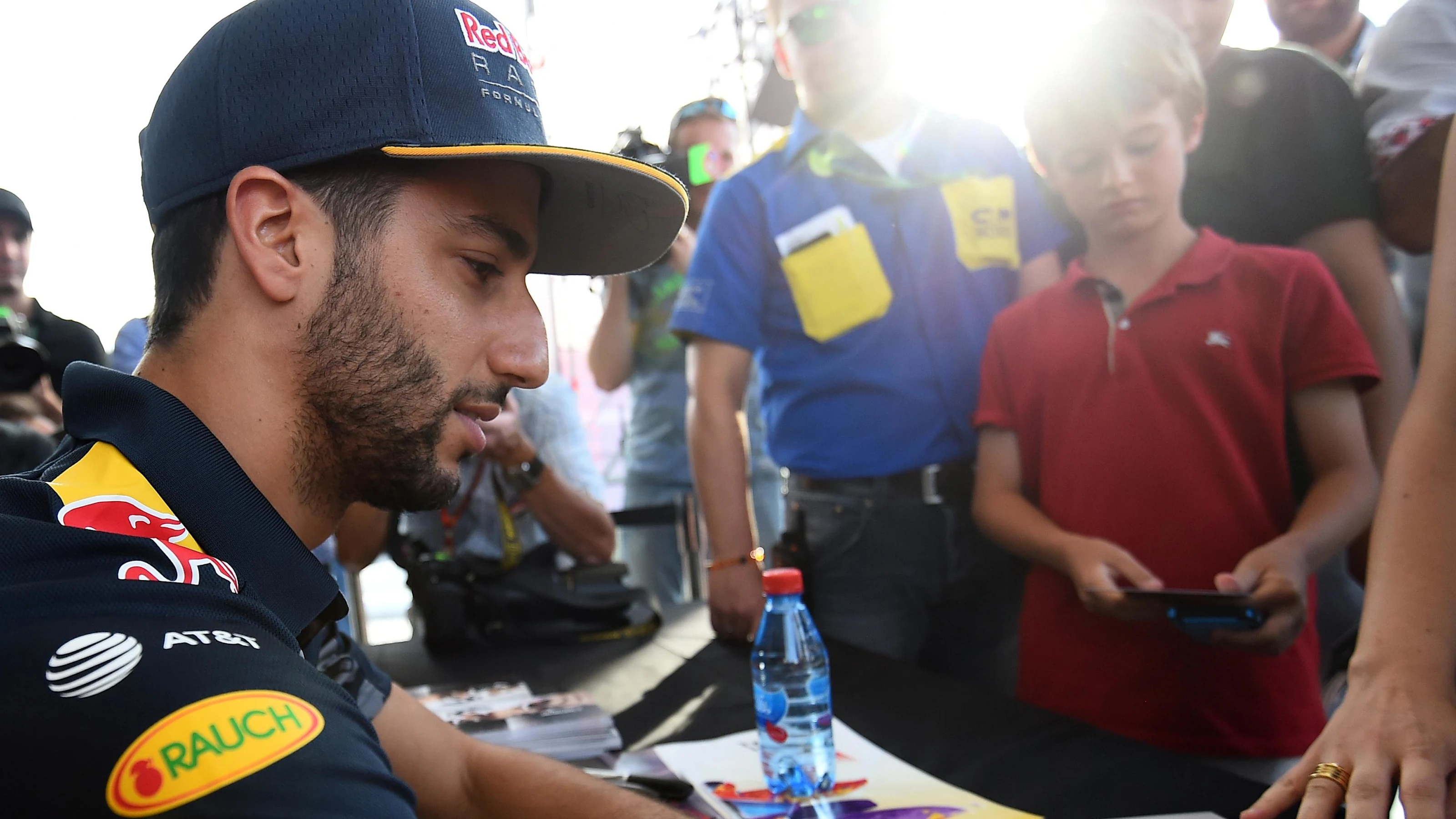 Daniel Ricciardo (AUS) Red Bull Racing signs autographs for the fans at Formula One World