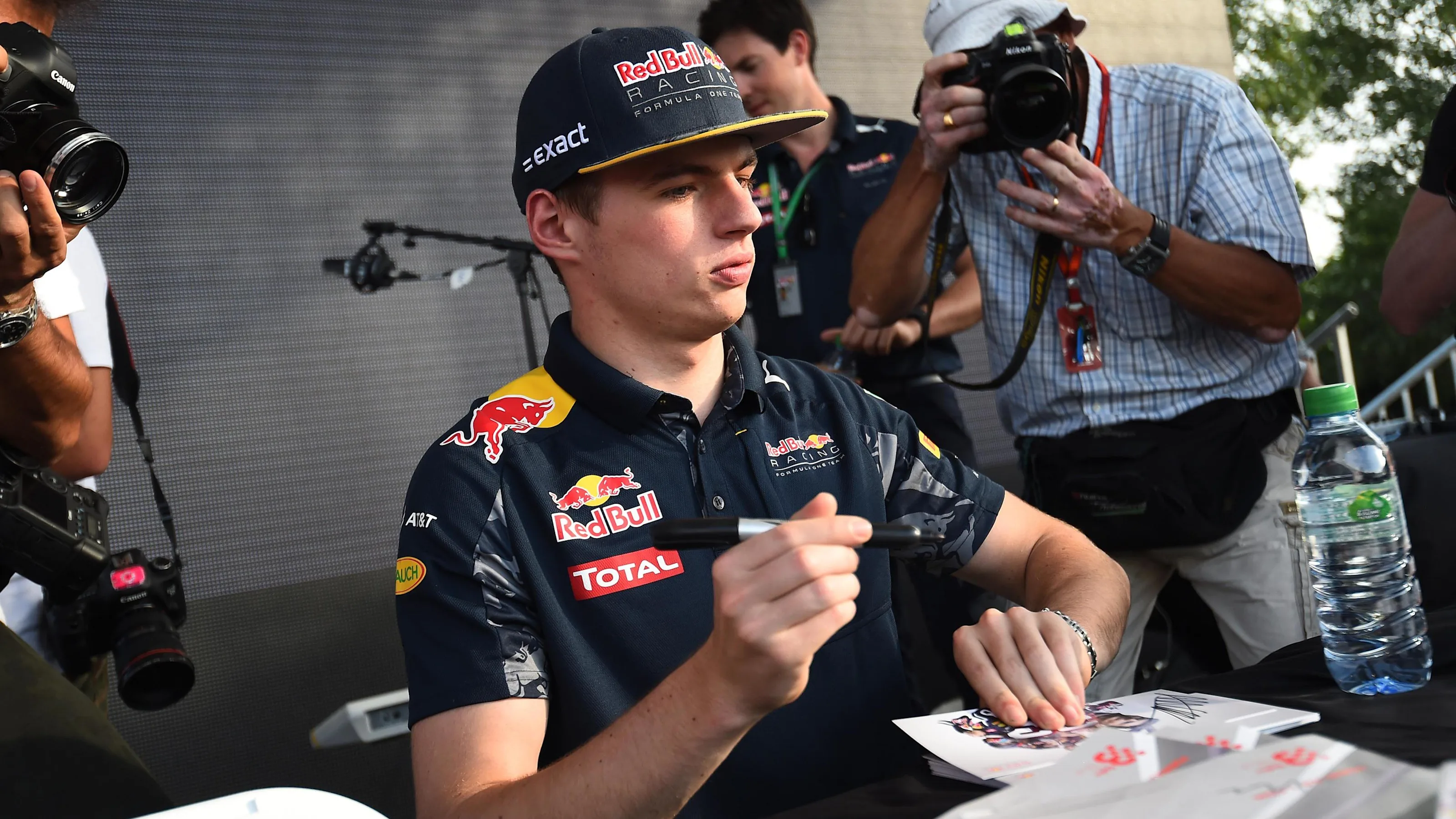 Max Verstappen (NED) Red Bull Racing signs autographs for the fans at Formula One World