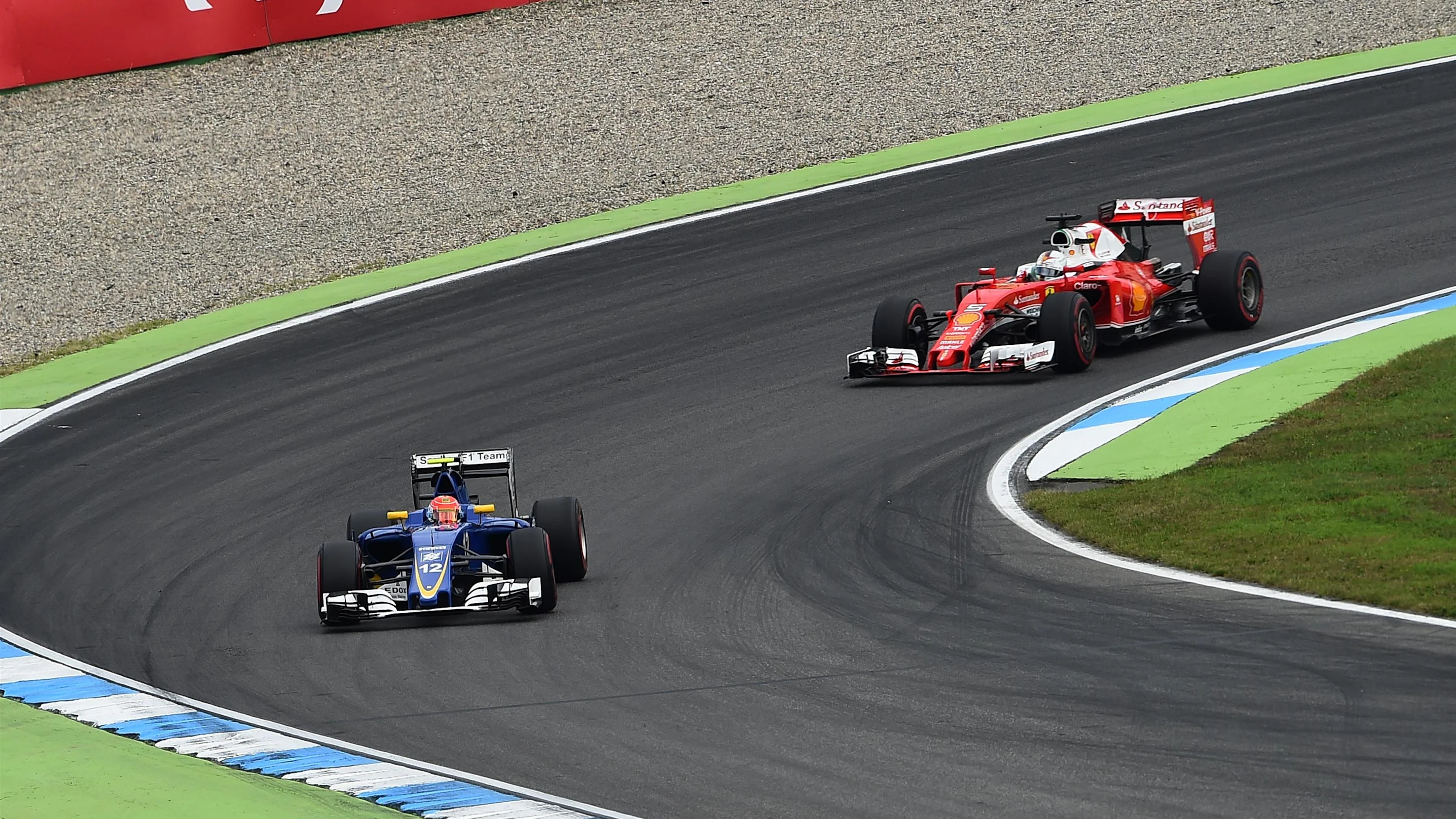 Felipe Nasr (BRA) Sauber C35 and Sebastian Vettel (GER) Ferrari SF16-H at Formula One World