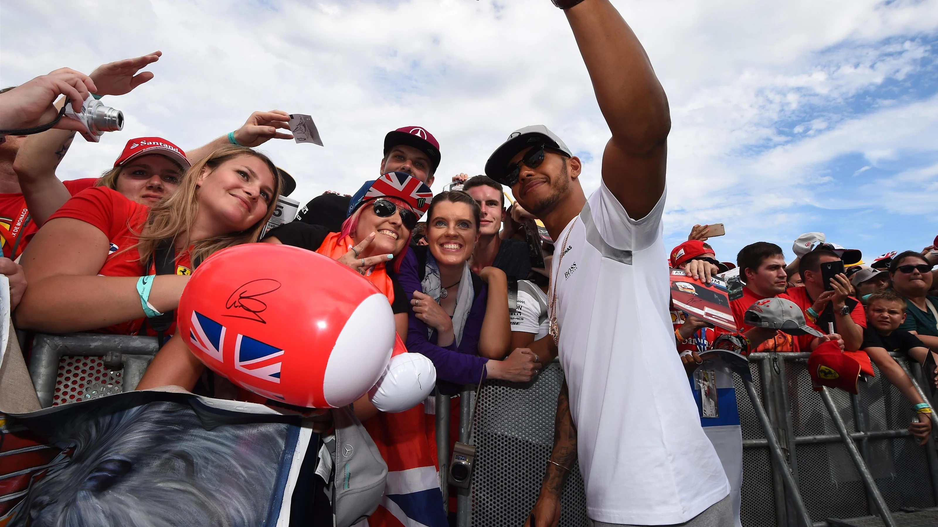 Lewis Hamilton (GBR) Mercedes AMG F1 poses for a selfie photograph with the fans at the autograph