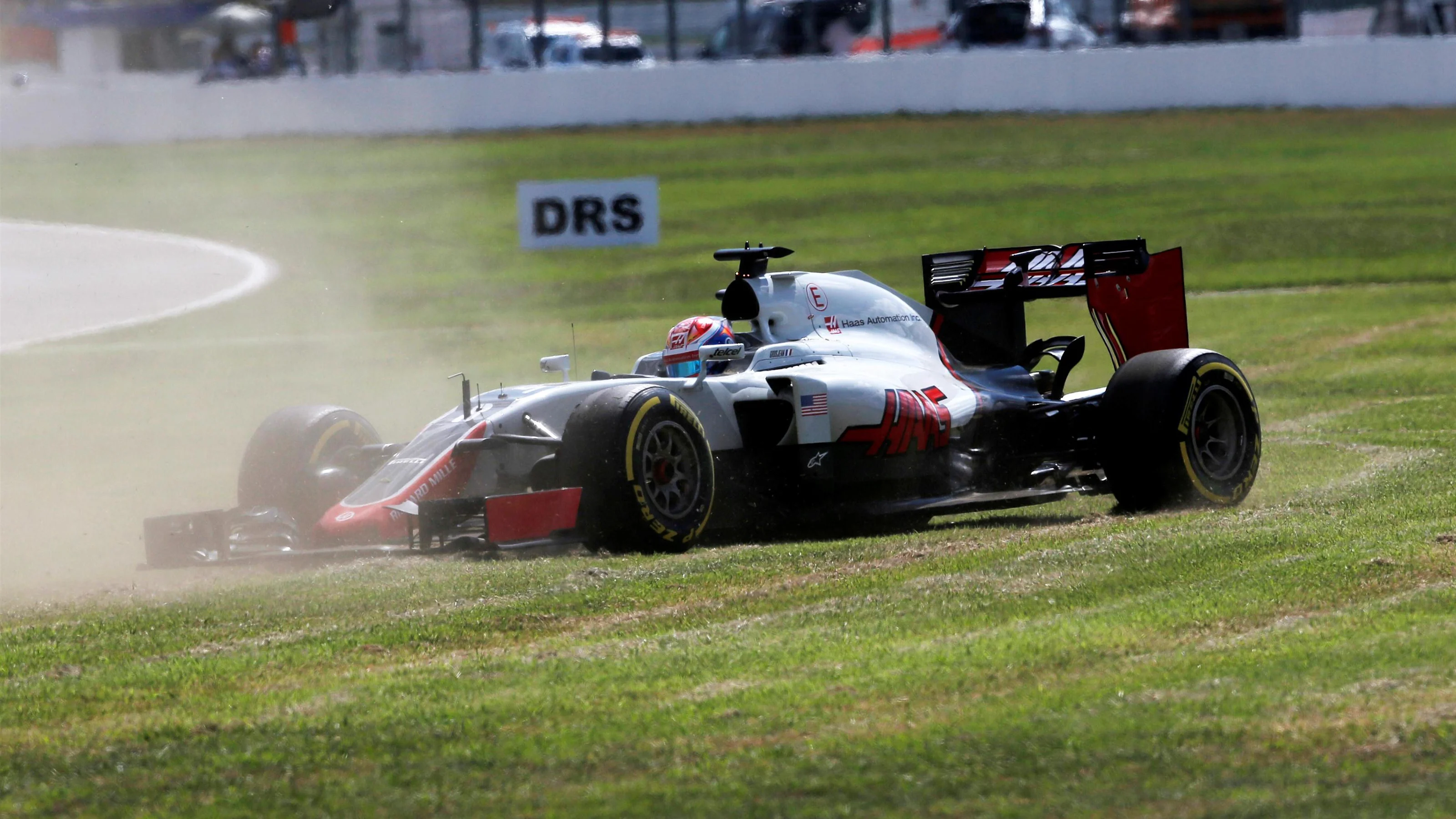 Romain Grosjean (FRA) Haas VF-16 spins across the grass at Formula One World Championship, Rd12,