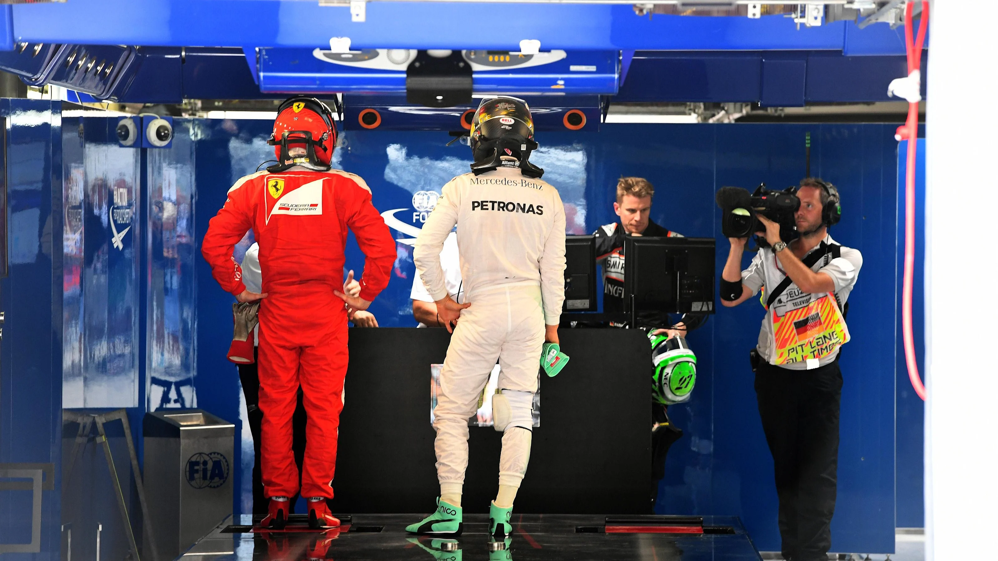 Kimi Raikkonen (FIN) Ferrari and Nico Rosberg (GER) Mercedes AMG F1 in parc ferme at Formula One
