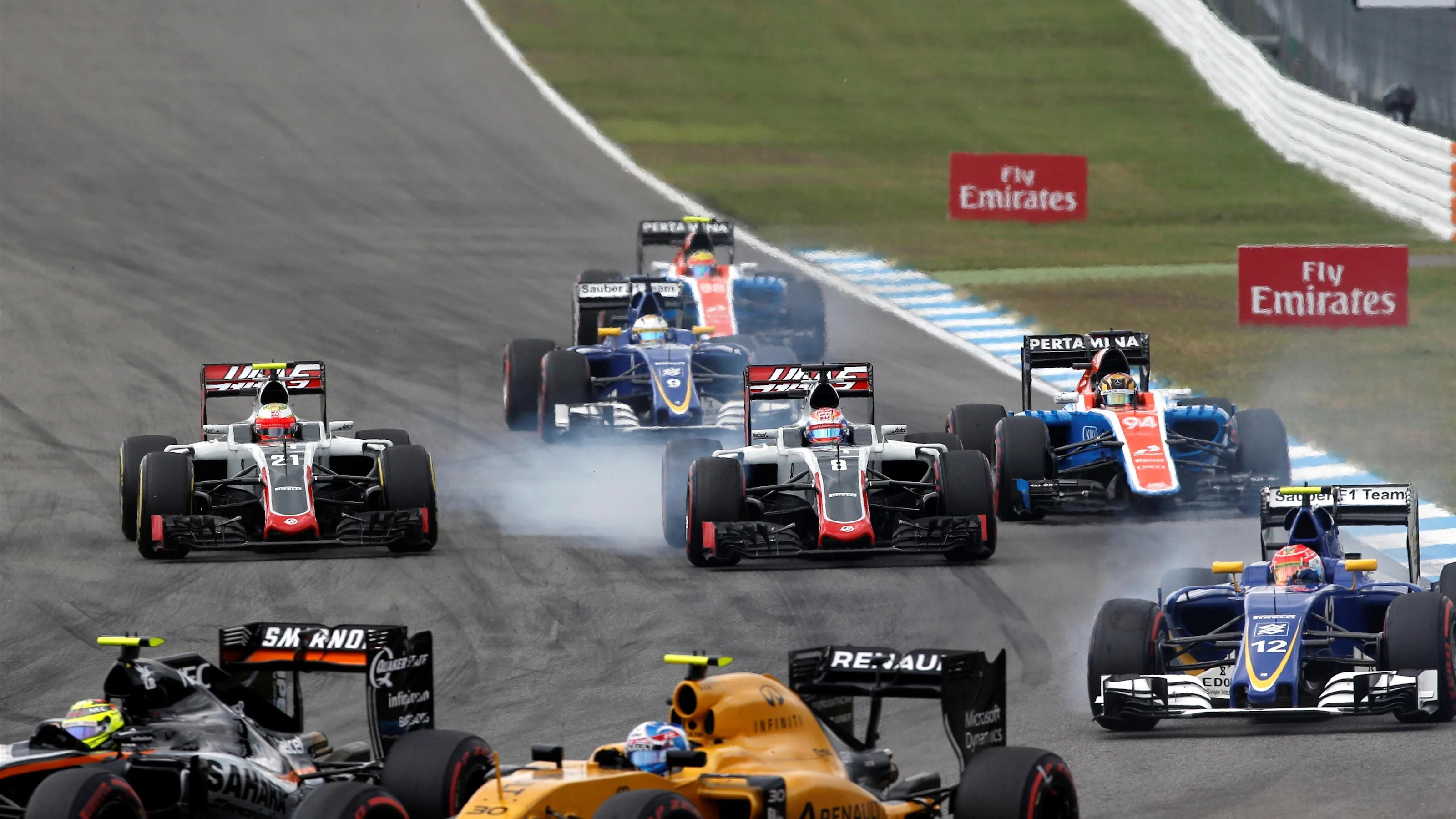 Esteban Gutierrez (MEX) Haas VF-16 and Romain Grosjean (FRA) Haas VF-16 lock up and battle for