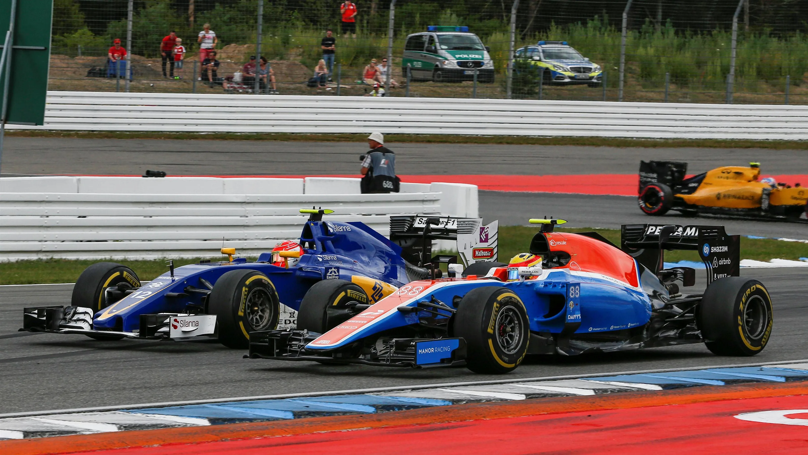 Felipe Nasr (BRA) Sauber C35 and Rio Haryanto (IDN) Manor Racing MRT05 battle for position at