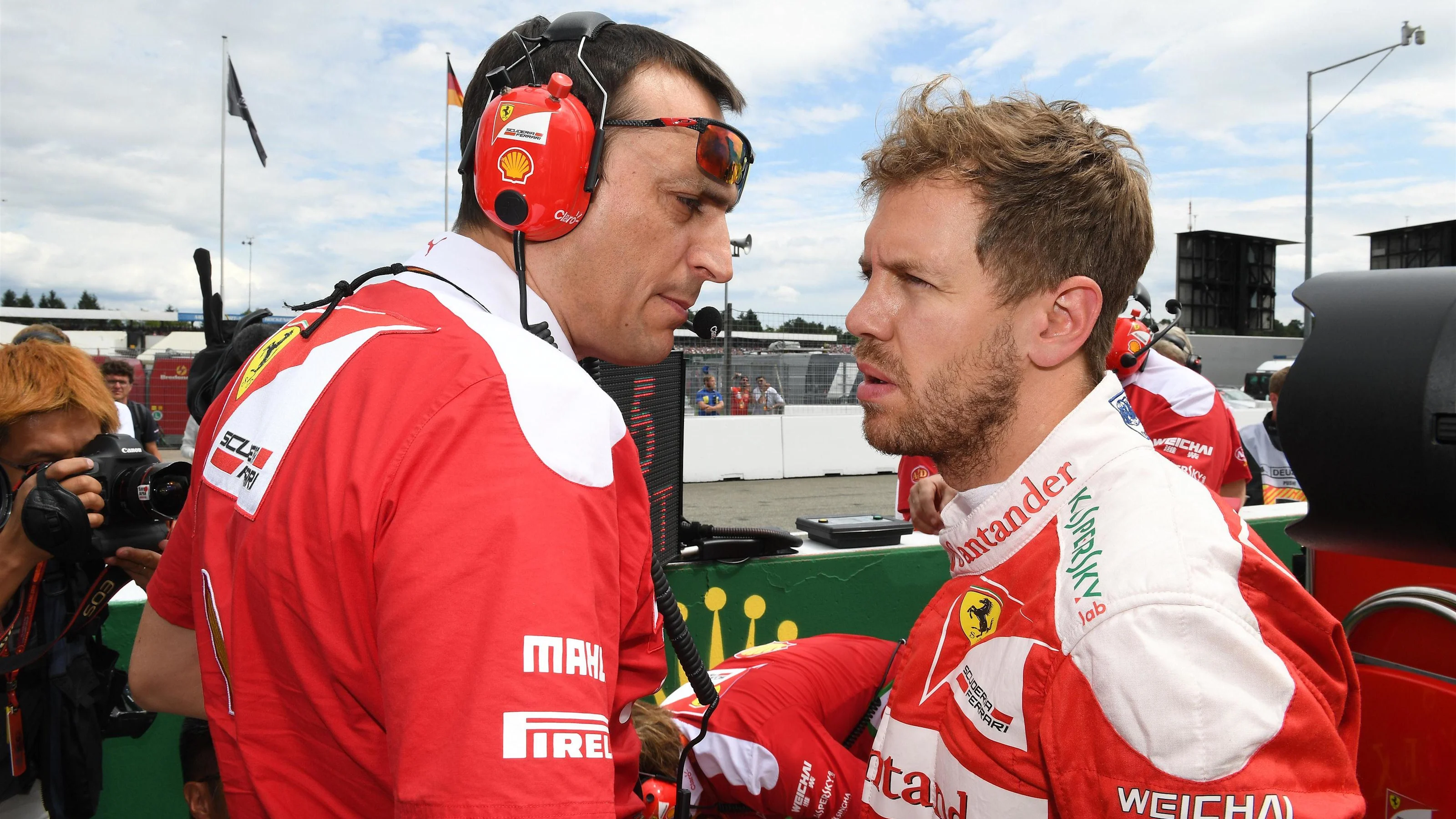 Sebastian Vettel (GER) Ferrari and Riccardo Adami (ITA) Ferrari Race Engineer on the grid at