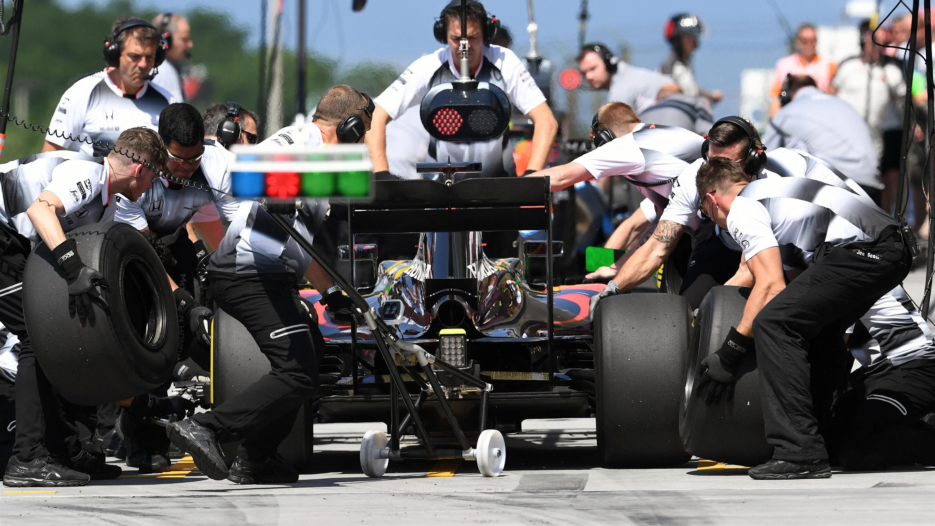 Fernando Alonso (ESP) McLaren MP4-31 pit stop at Formula One World Championship, Rd11, Practice,