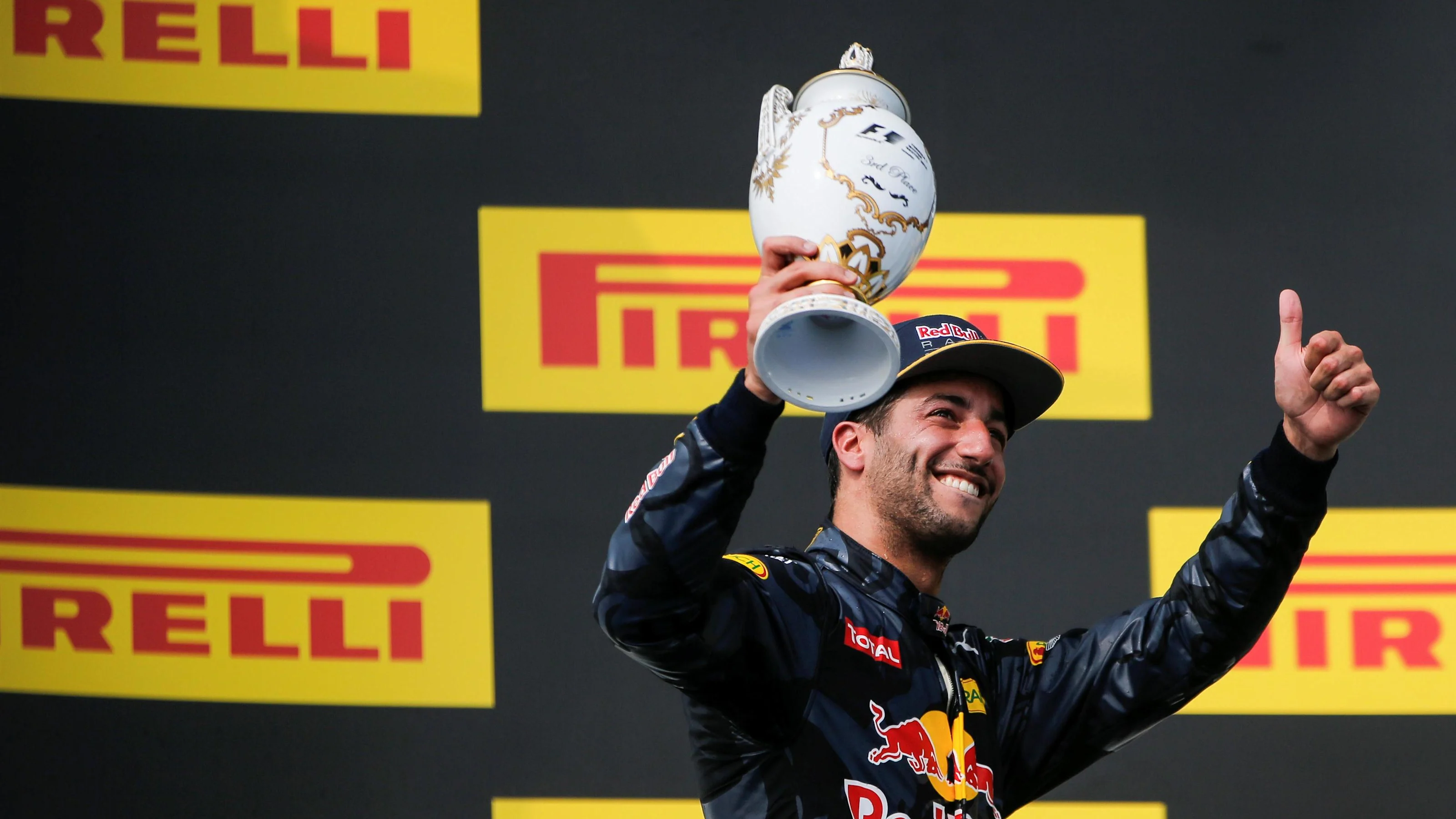Daniel Ricciardo (AUS) Red Bull Racing celebrates on the podium with the trophy at Formula One