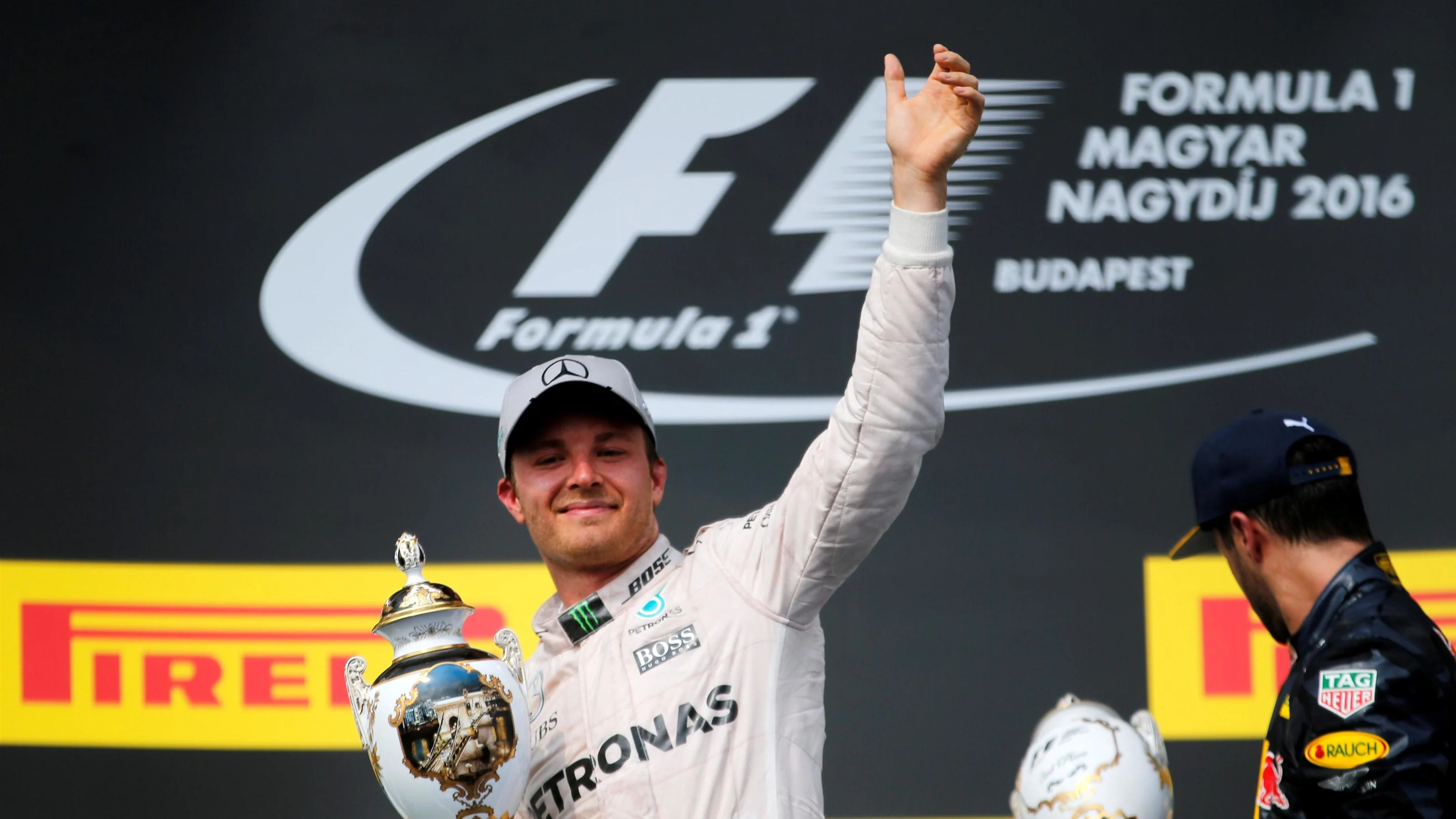 Nico Rosberg (GER) Mercedes AMG F1 celebrates on the podium with the trophy at Formula One World
