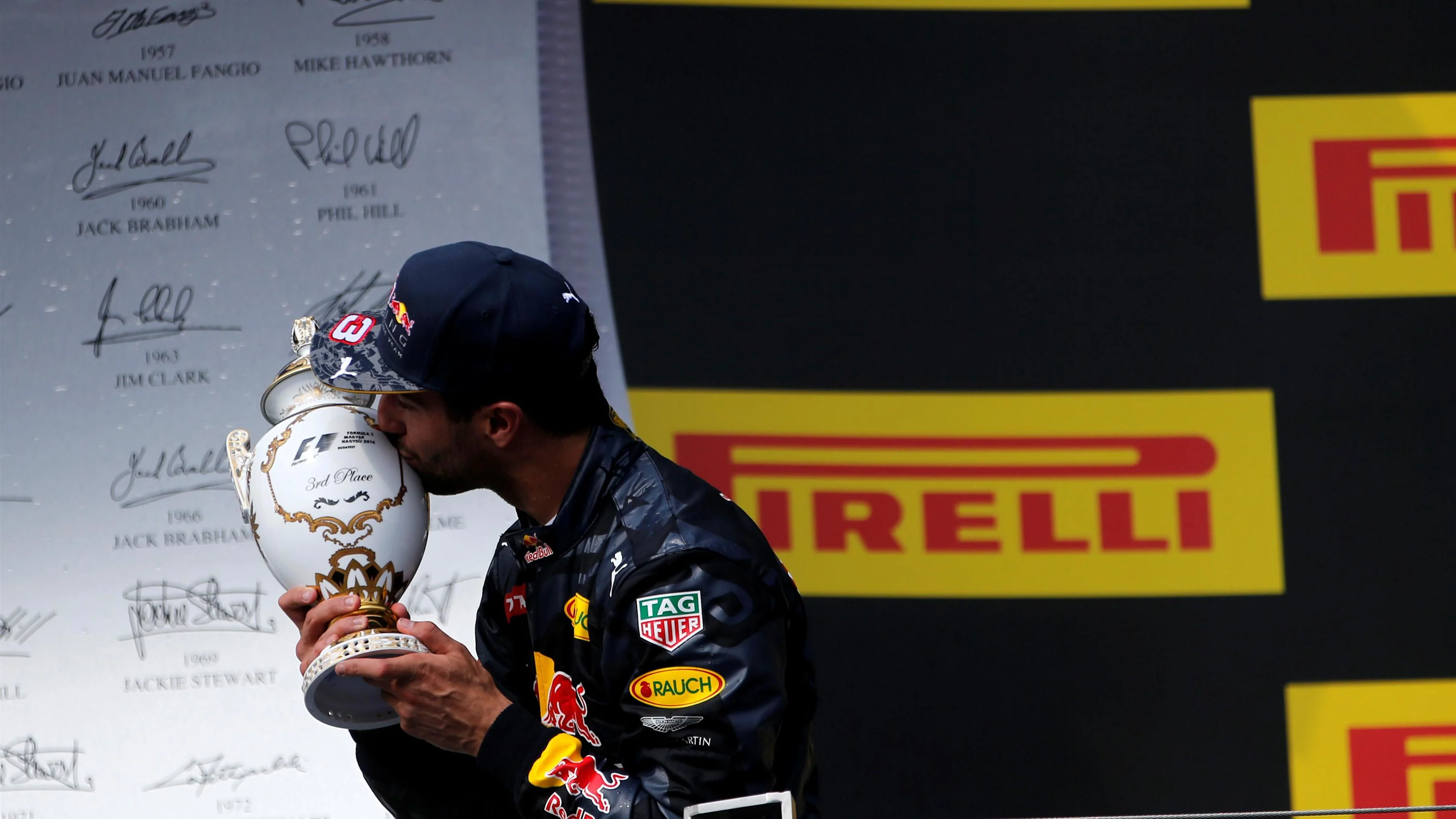 Daniel Ricciardo (AUS) Red Bull Racing celebrates on the podium with the trophy at Formula One