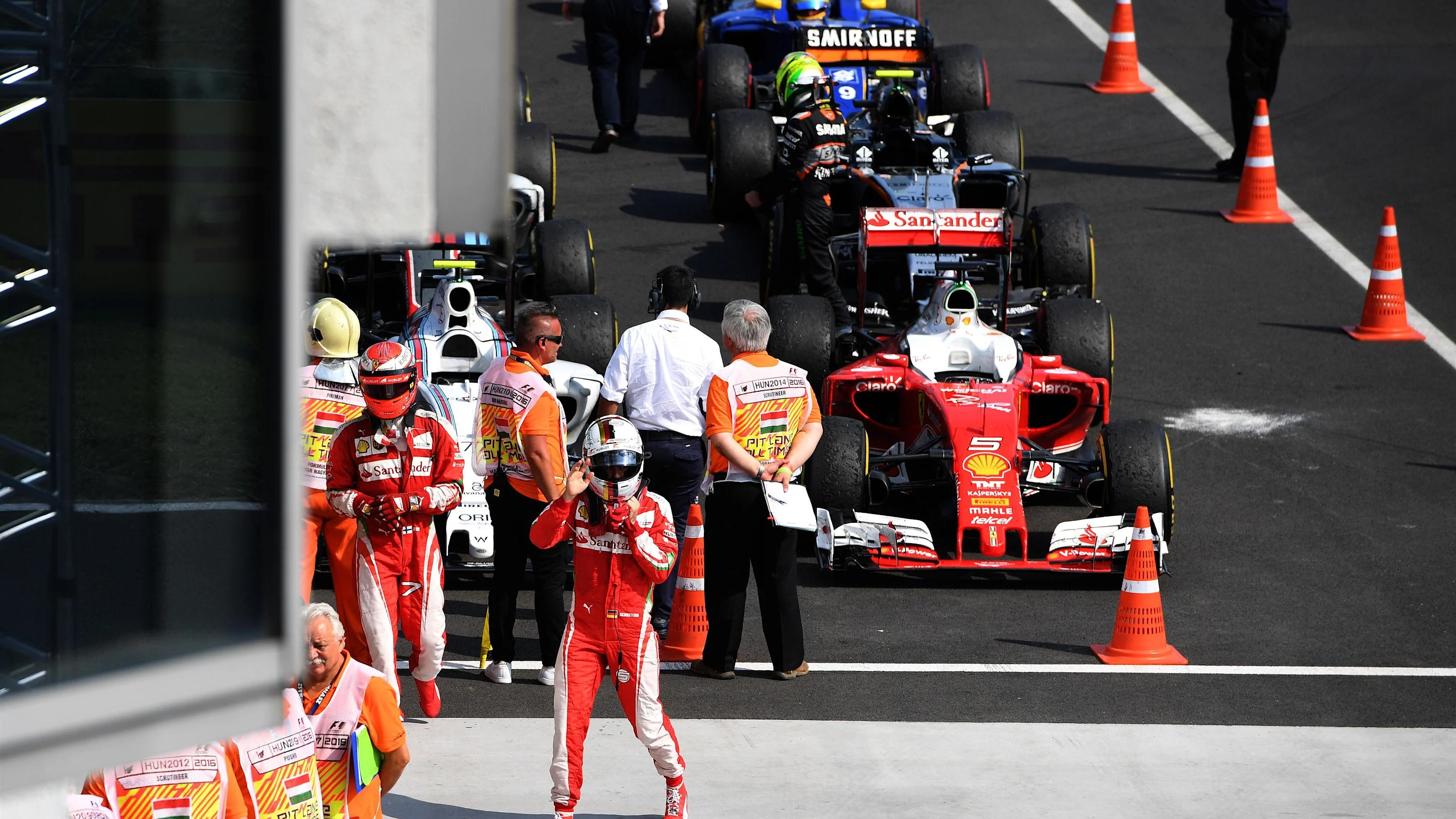 Kimi Raikkonen (FIN) Ferrari and Vitaly Petrov (RUS) in parc ferme at Formula One World