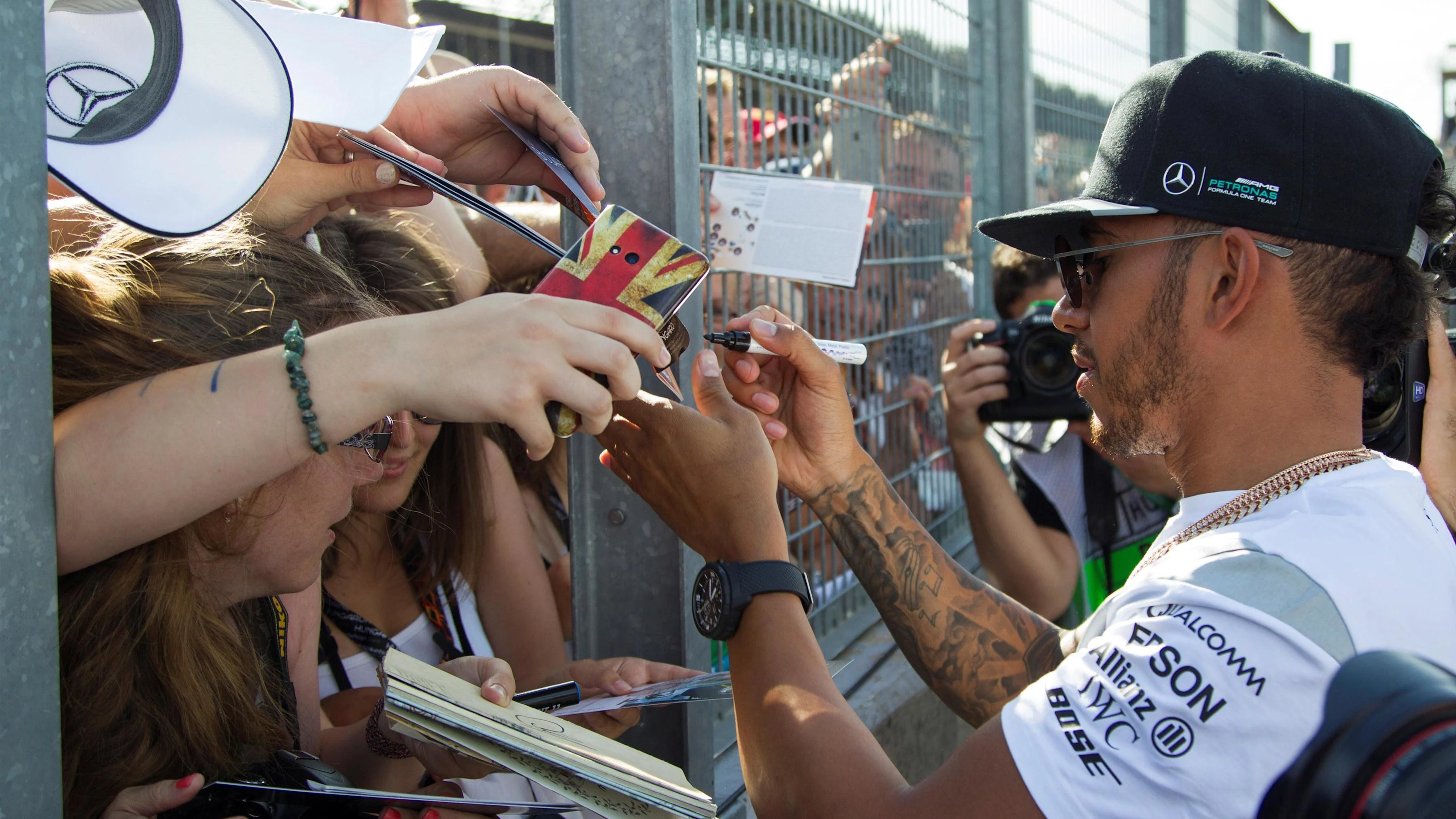 Lewis Hamilton (GBR) Mercedes AMG F1 signs autographs for the fans at Formula One World