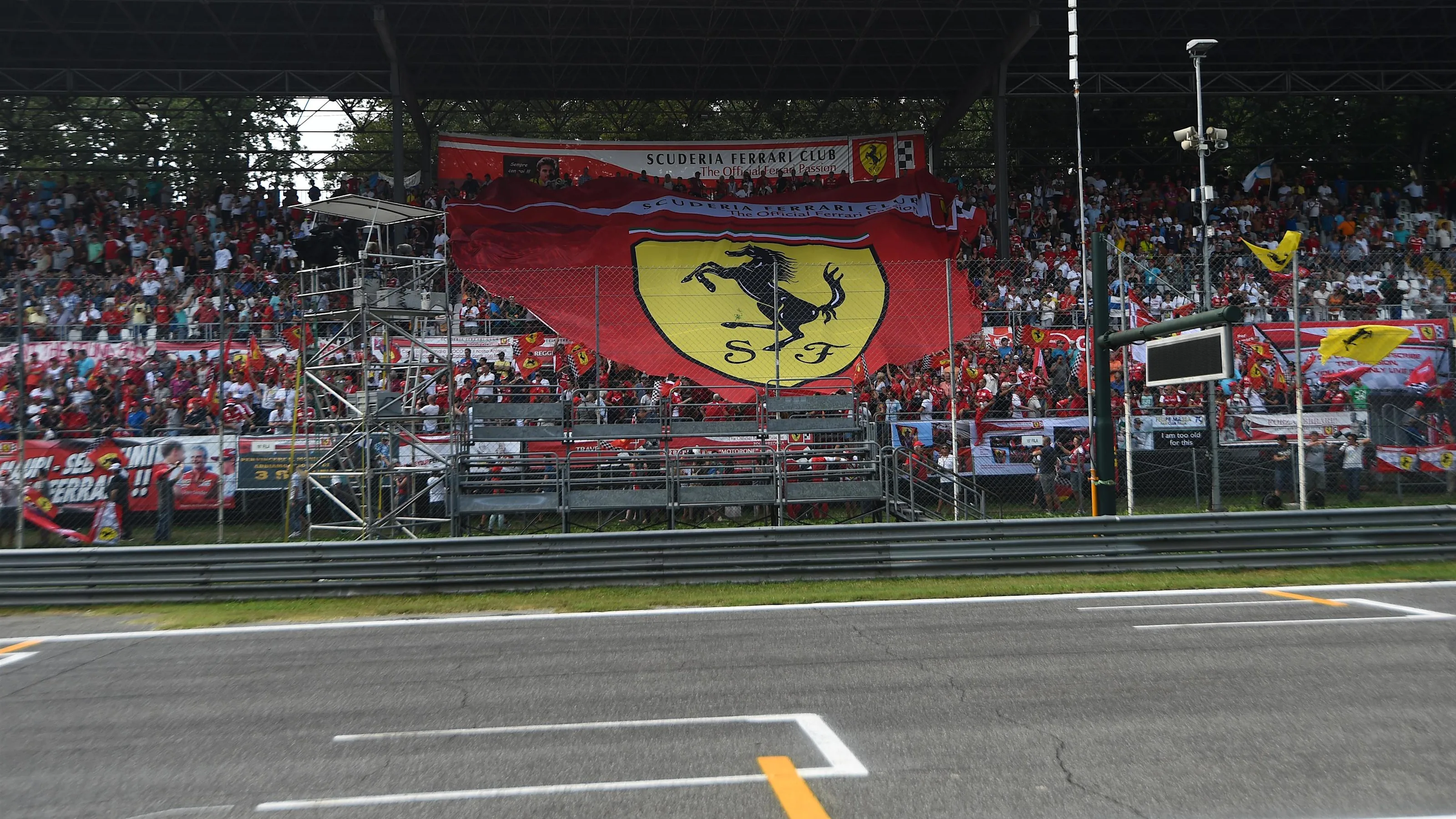 Ferrari tifosi fans in the grandstand with flags at Formula One World Championship, Rd14, Italian