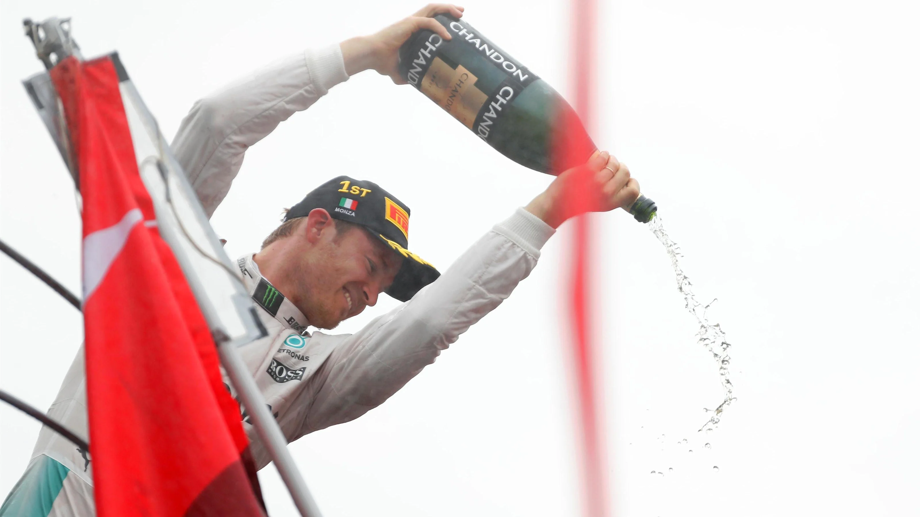 Race winner Nico Rosberg (GER) Mercedes AMG F1 celebrates on the podium with the champagne at