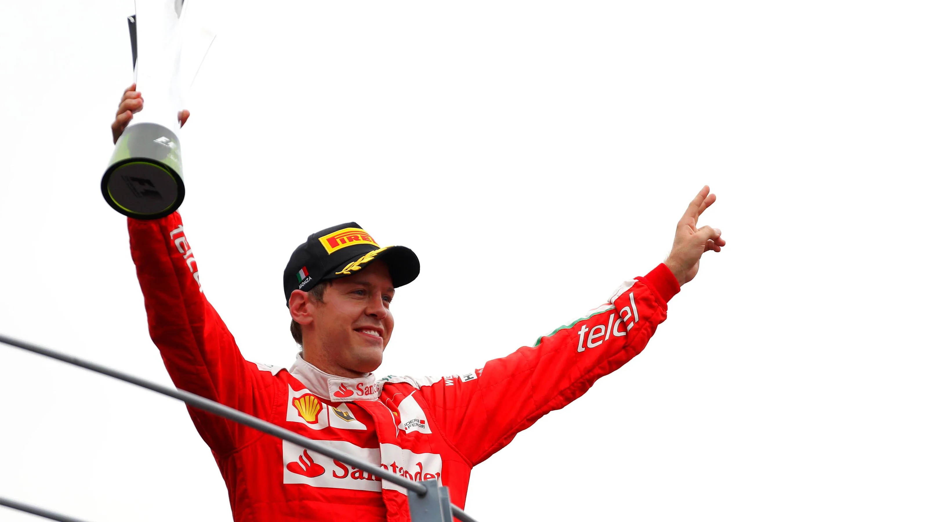 Sebastian Vettel (GER) Ferrari celebrates on the podium with the trophy at Formula One World