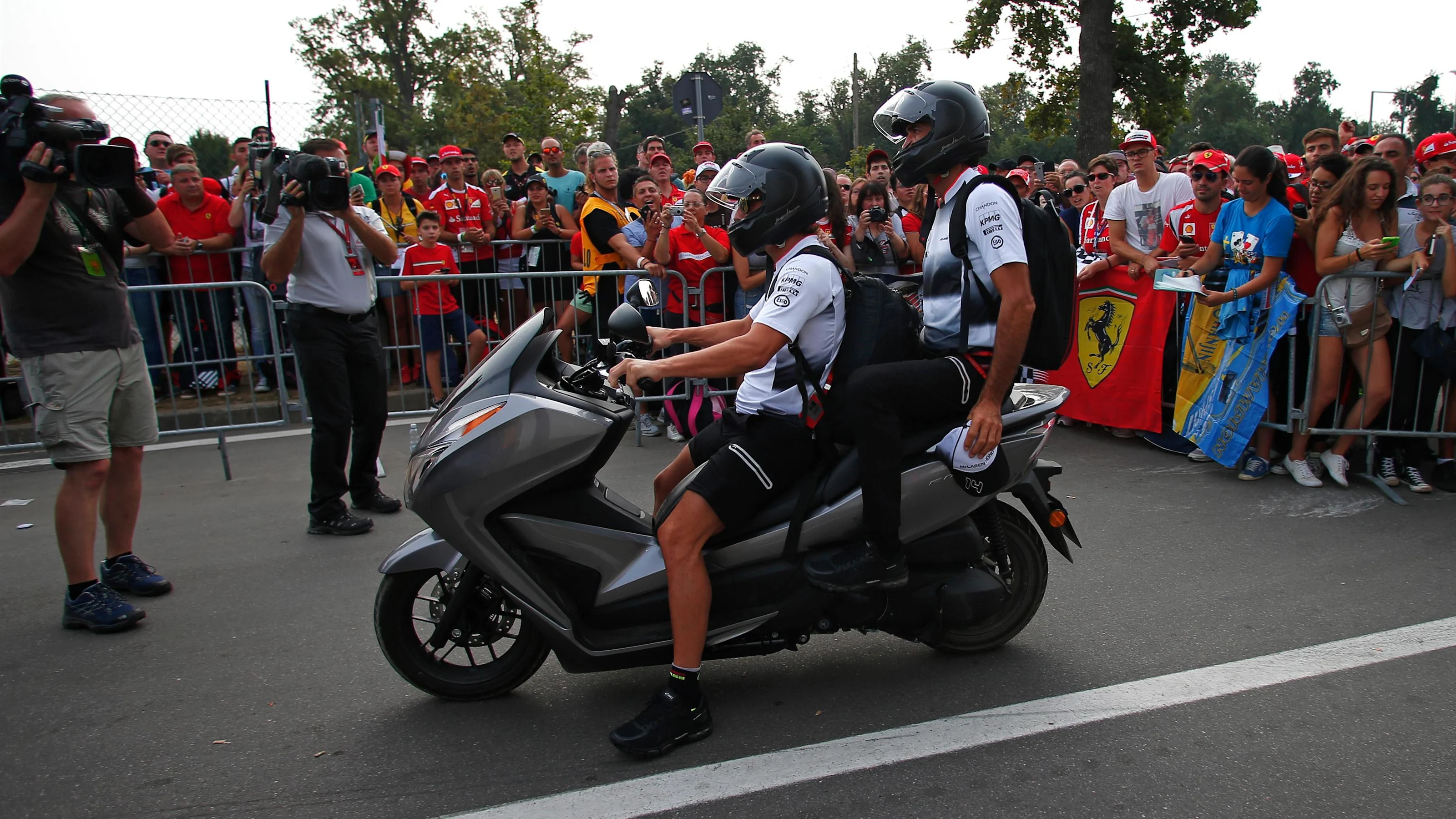 Fernando Alonso (ESP) McLaren on a scooter at Formula One World Championship, Rd14, Italian Grand