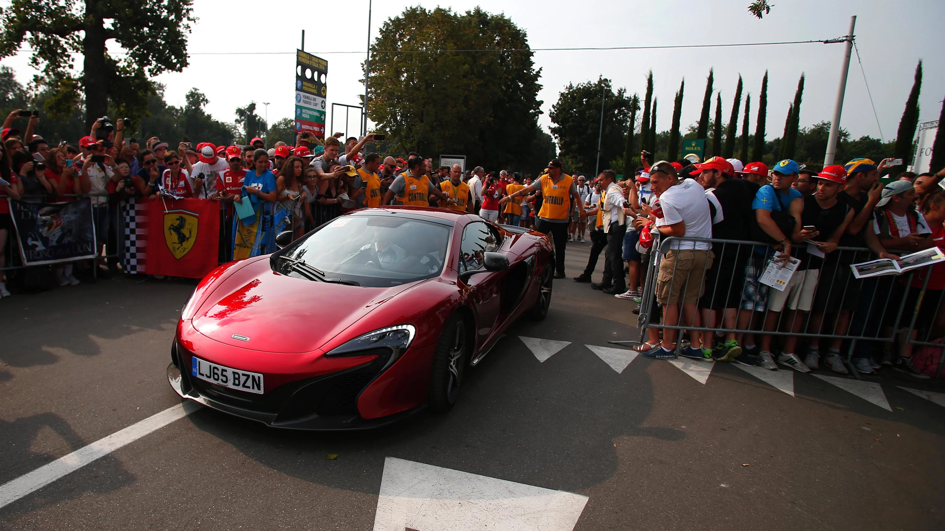 Jenson Button (GBR) McLaren and McLaren 570s at Formula One World Championship, Rd14, Italian Grand