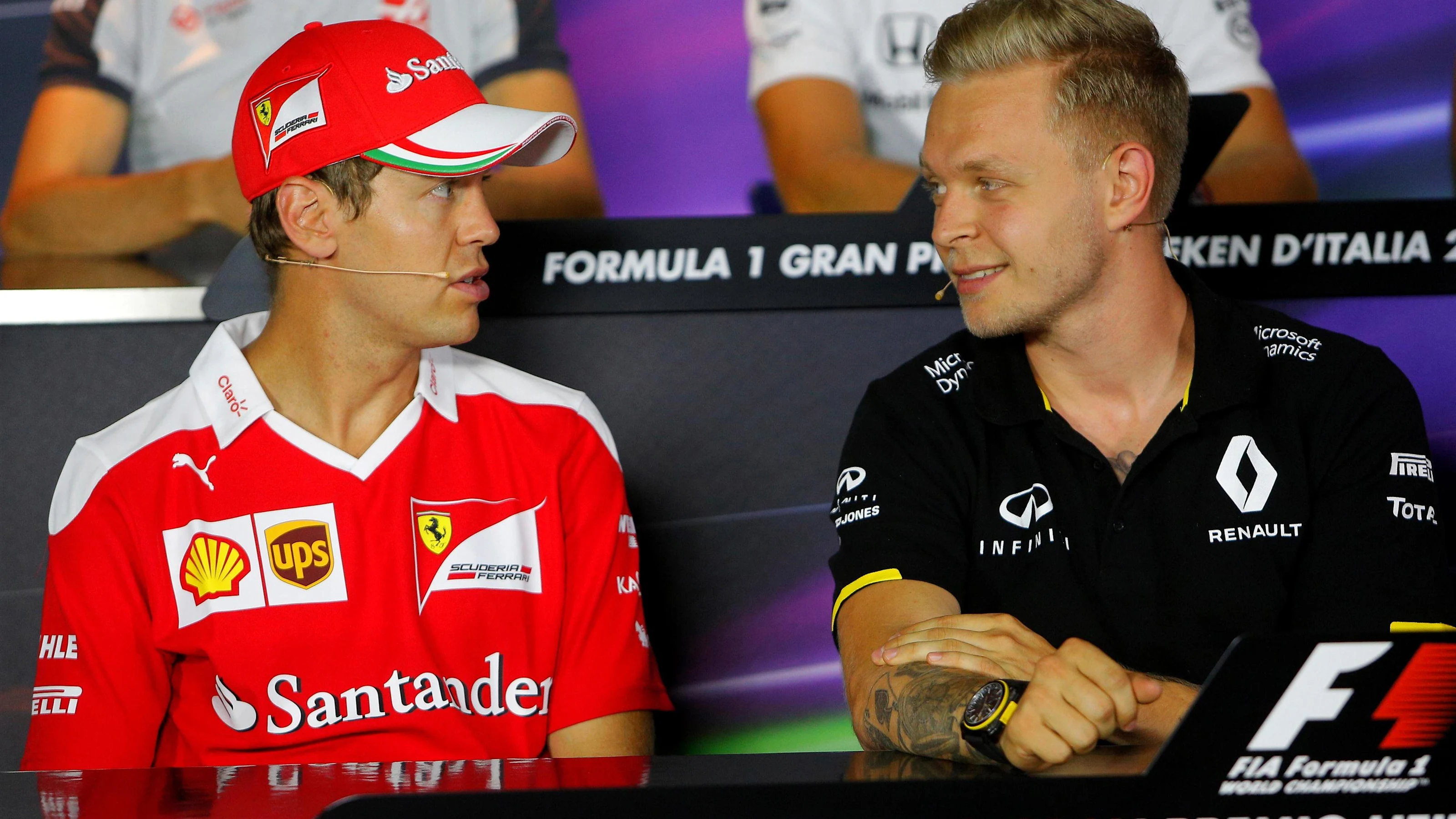 Sebastian Vettel (GER) Ferrari and Kevin Magnussen (DEN) Renault Sport F1 Team in the Press