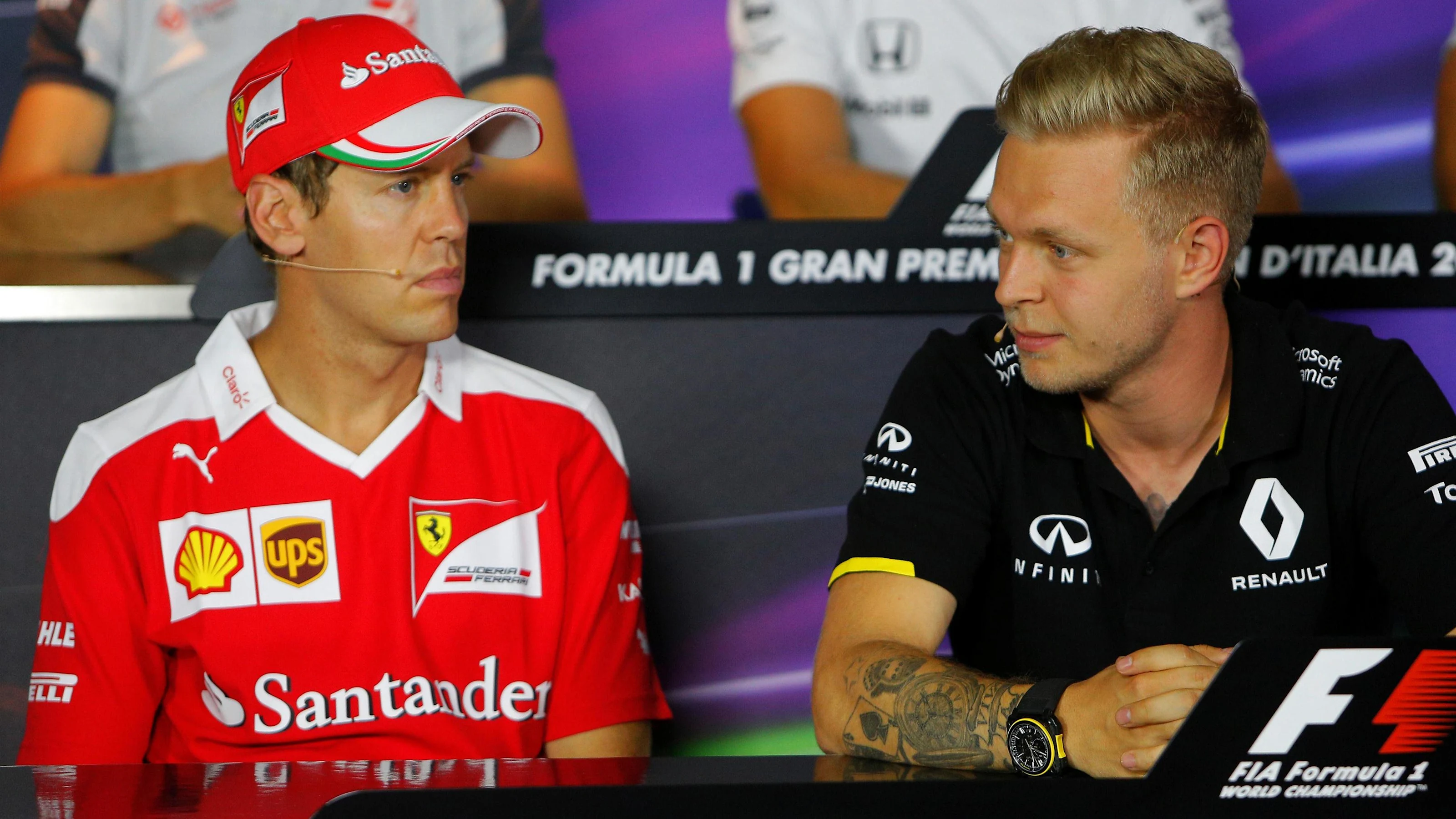 Sebastian Vettel (GER) Ferrari and Kevin Magnussen (DEN) Renault Sport F1 Team in the Press