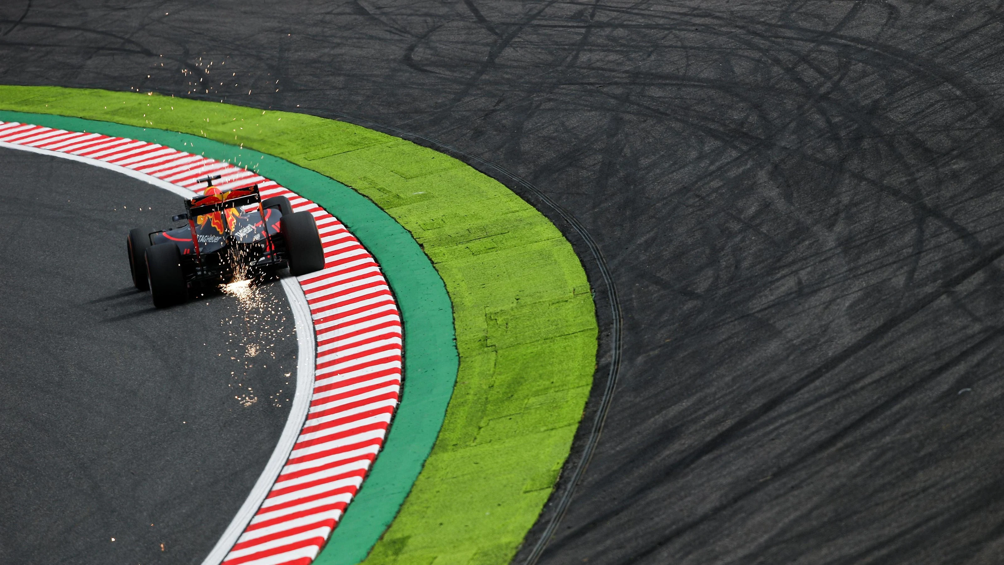 Daniel Ricciardo (AUS) Red Bull Racing RB12 and sparks at Formula One World Championship, Rd17,