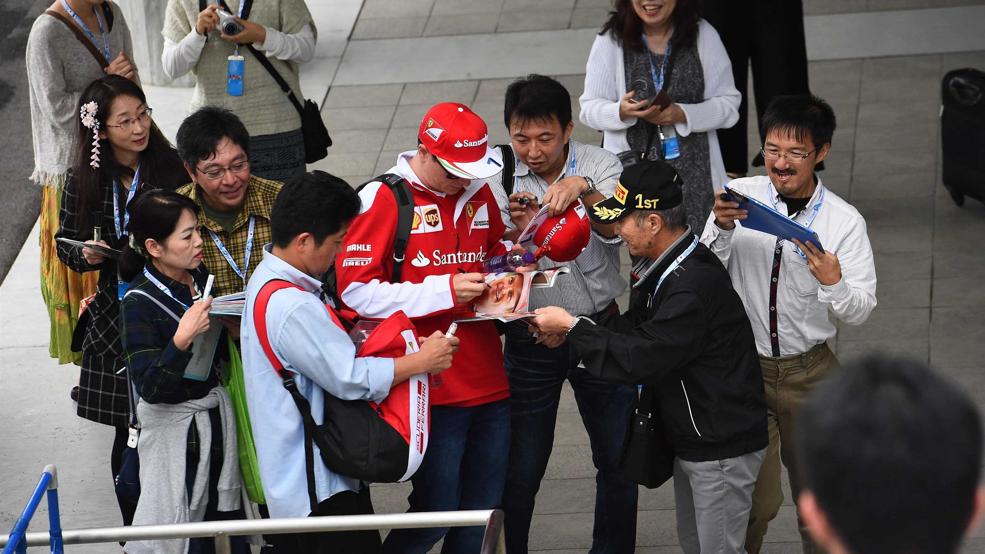 Kimi Raikkonen (FIN) Ferrari signs autographs for the fans at Formula One World Championship, Rd17,