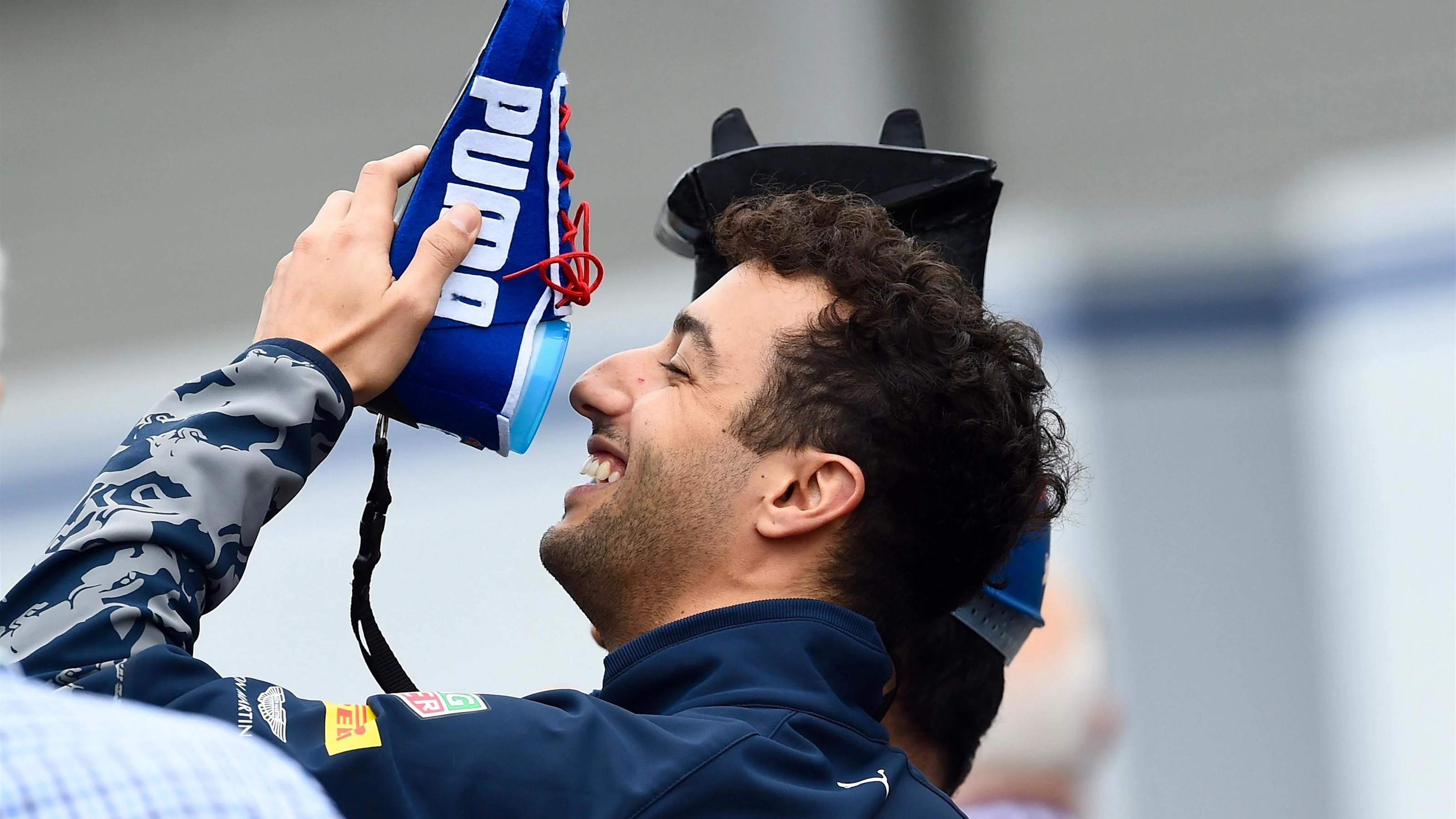 Daniel Ricciardo (AUS) Red Bull Racing performs the shoey at Formula One World Championship, Rd17,