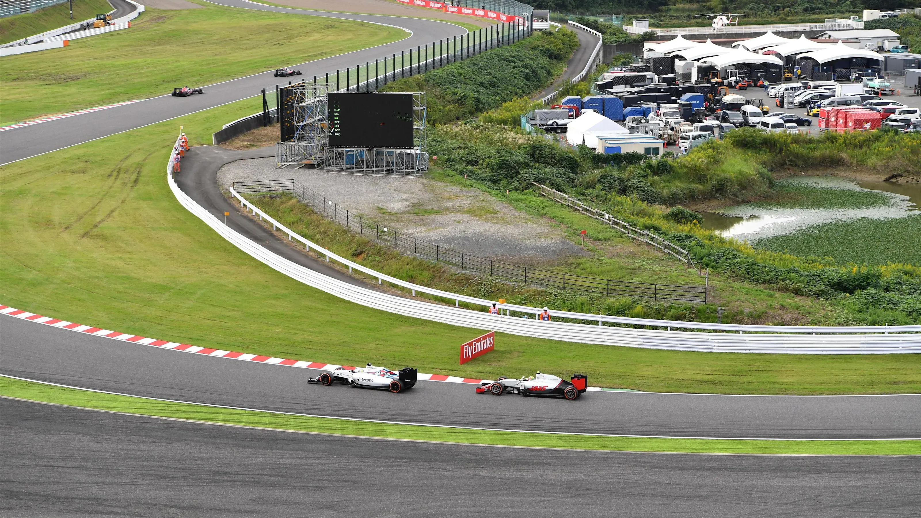 Felipe Massa (BRA) Williams FW38 and Esteban Gutierrez (MEX) Haas VF-16 at Formula One World