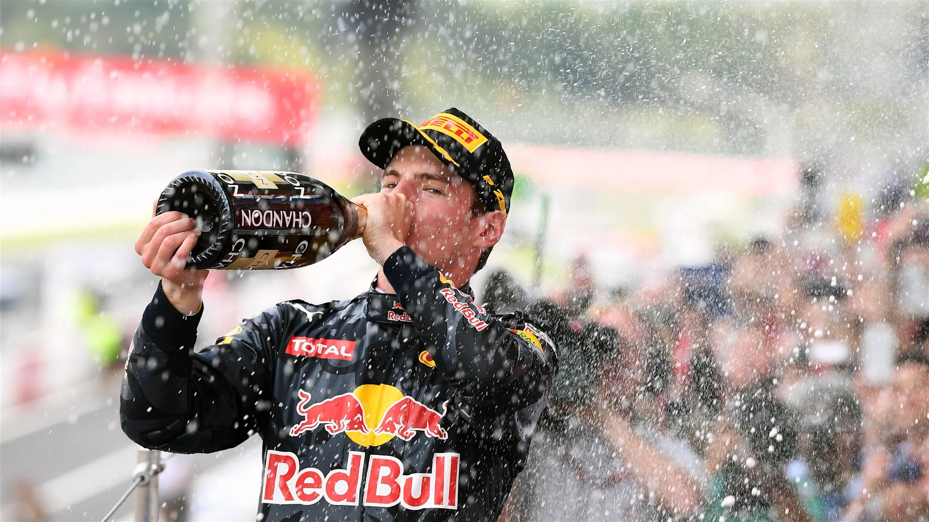 Max Verstappen (NED) Red Bull Racing celebrates on the podium with the champagne at Formula One