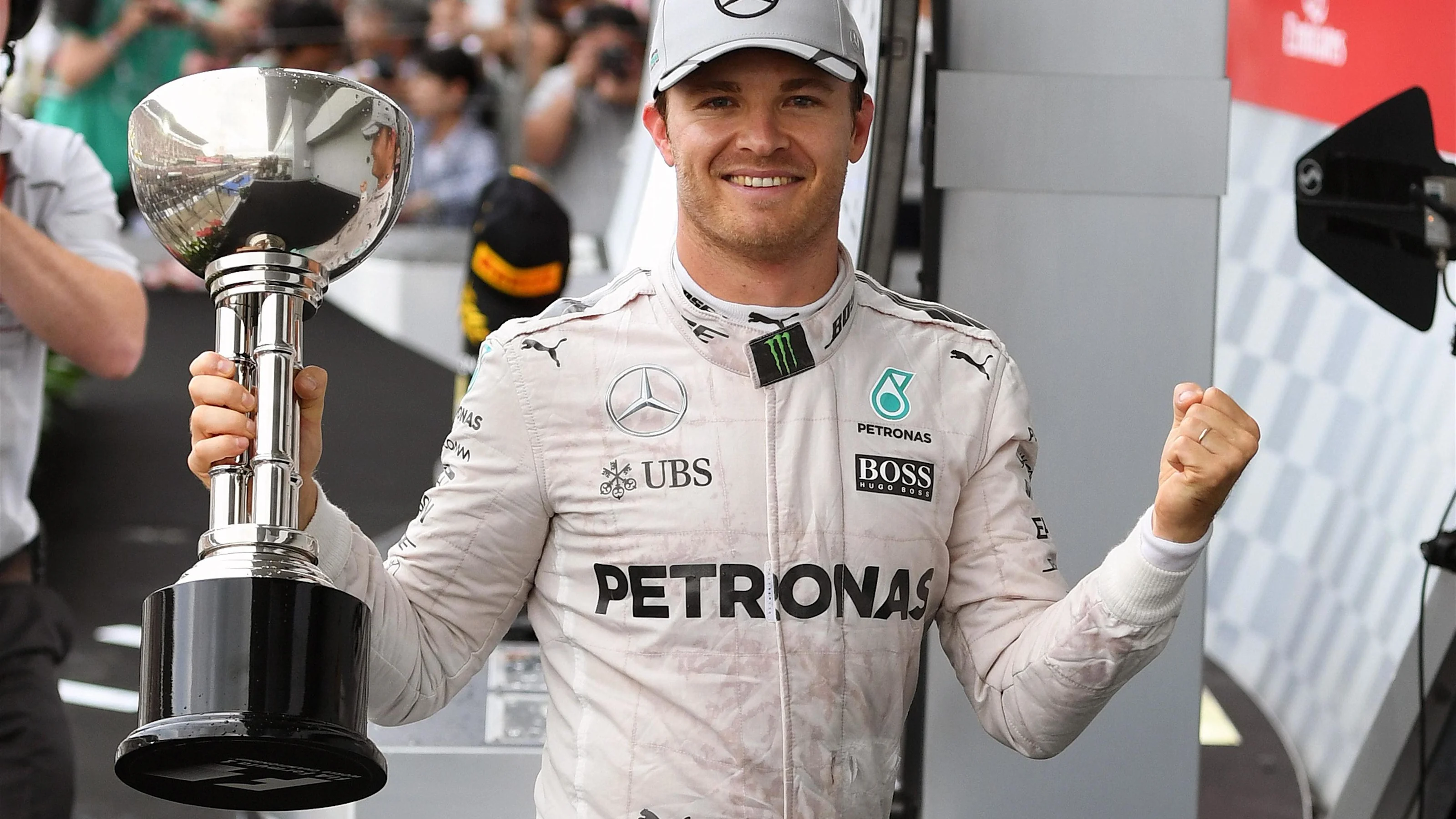 Race winner Nico Rosberg (GER) Mercedes AMG F1 celebrates on the podium with the trophy at Formula