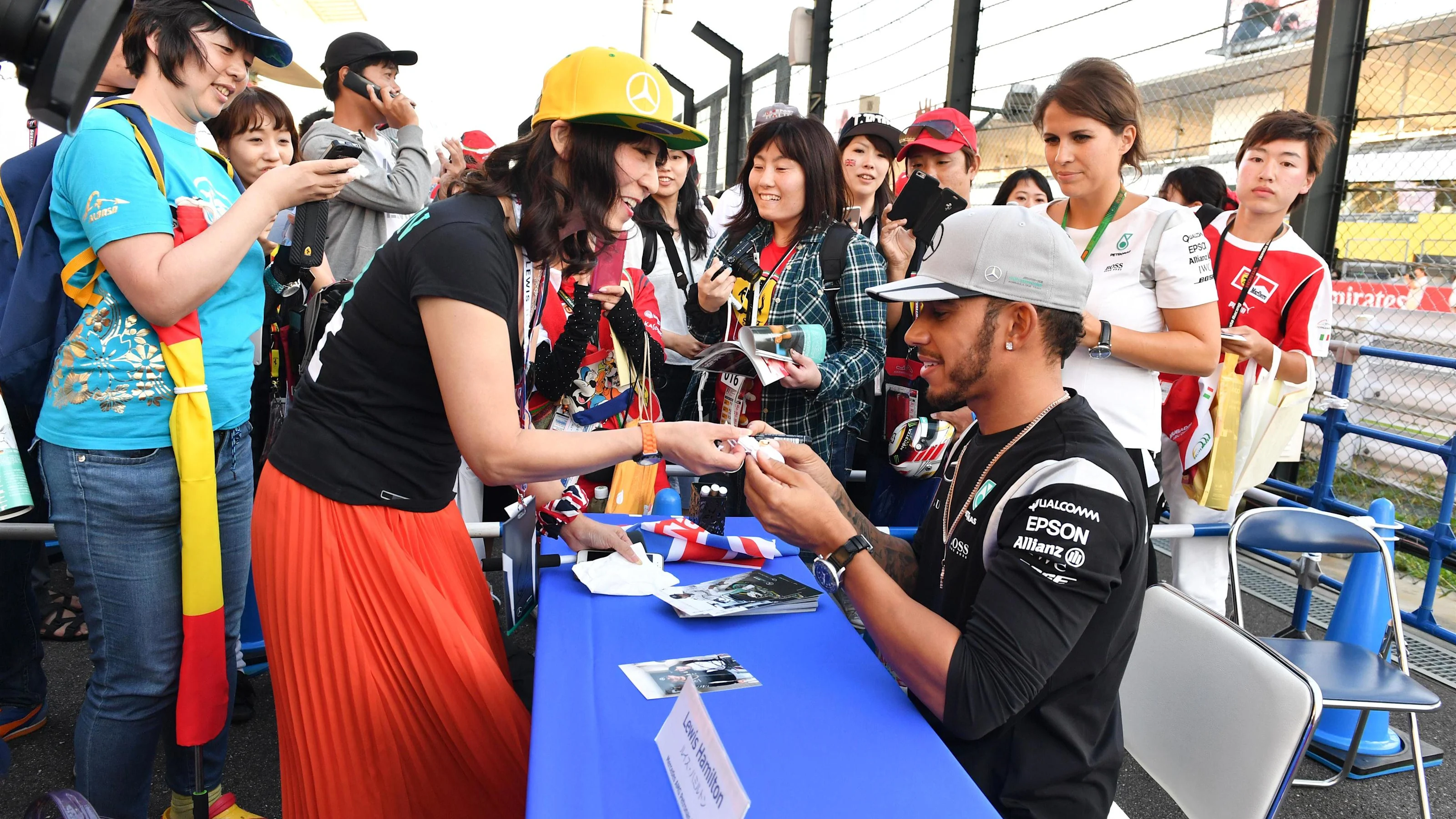 Lewis Hamilton (GBR) Mercedes AMG F1 signs autographs for the fans at Formula One World