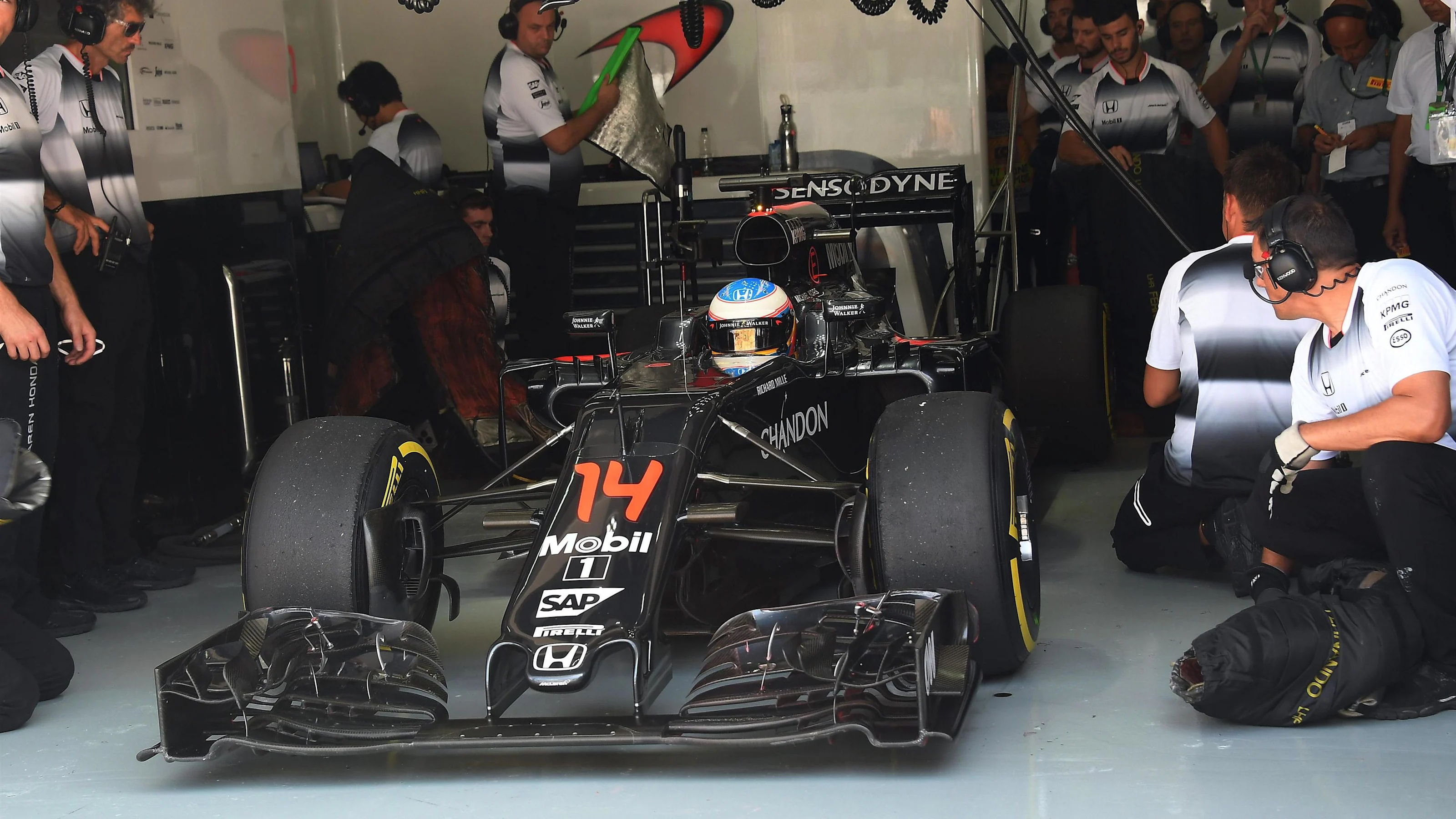 Fernando Alonso (ESP) McLaren MP4-31 in the garage at Formula One World Championship, Rd16,