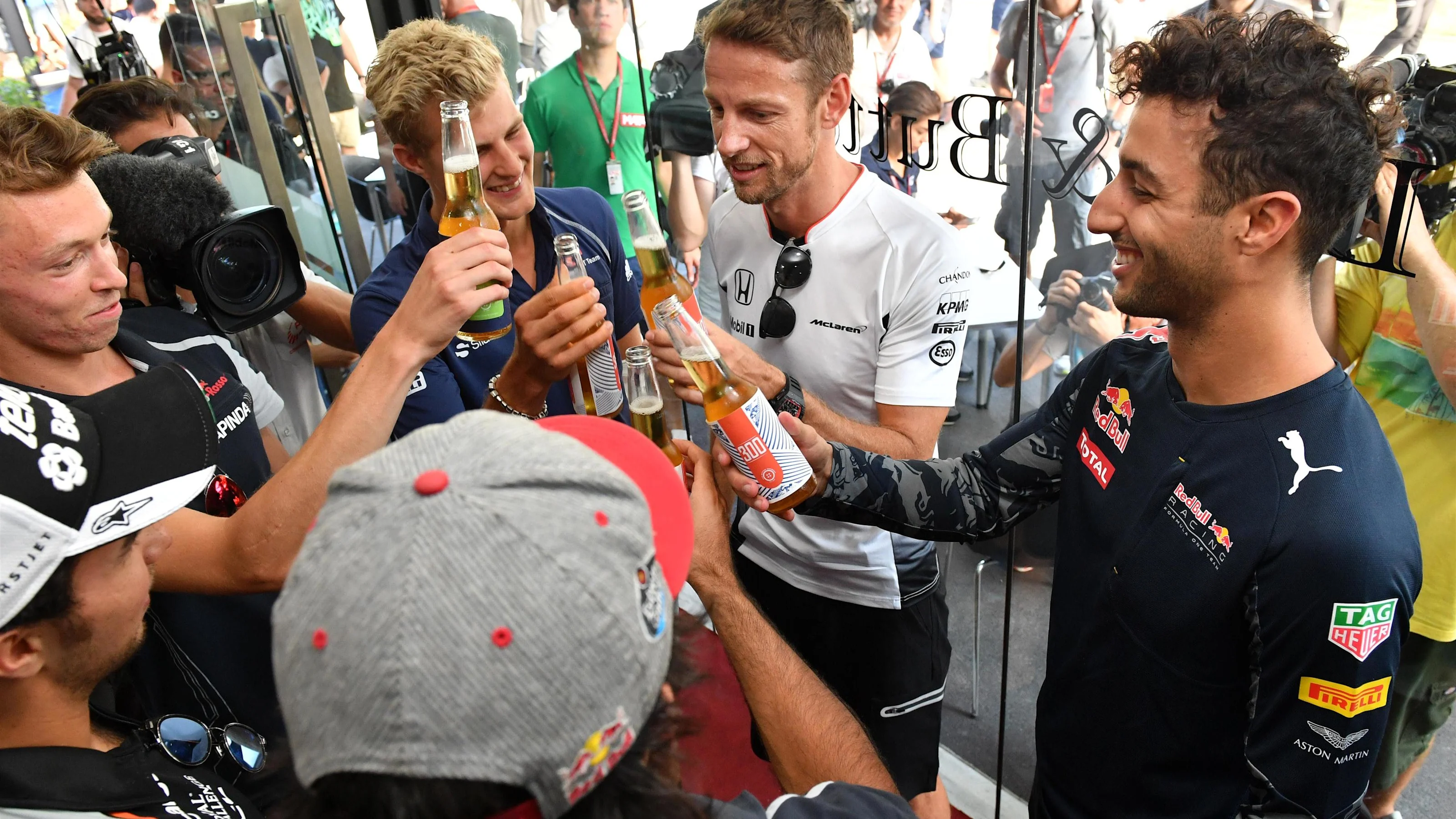 Jenson Button (GBR) McLaren celebrates his 300th Grand Prix with Daniel Ricciardo (AUS) Red Bull